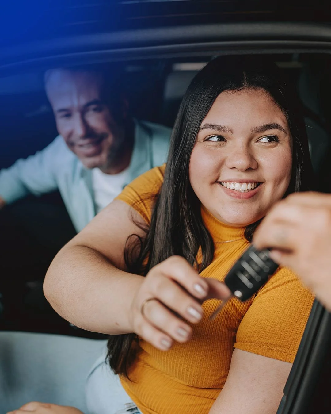 Woman being handed car keys.