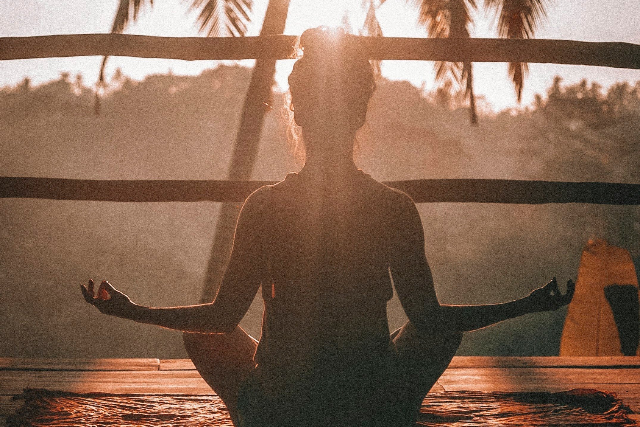 Woman meditating in a beautiful relaxing natur setting