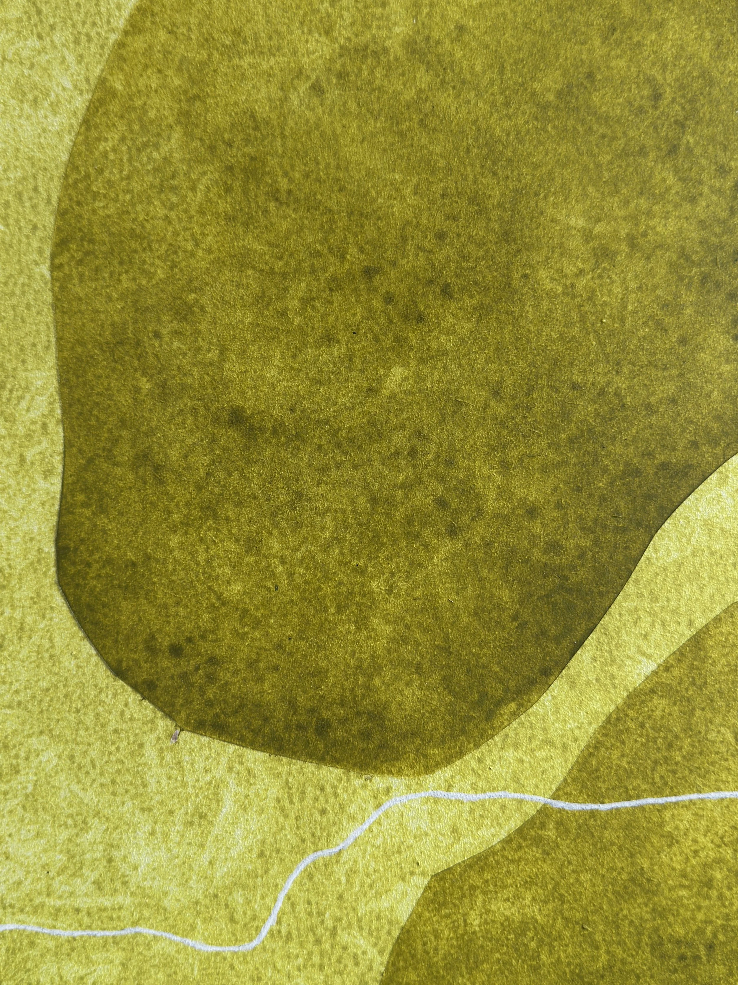 Nahaufnahme einer gelben und grünen Karte mit abstrakten Formen.