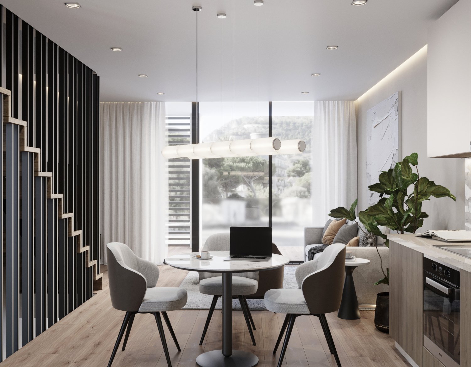 Modern living room with a round dining table, four white chairs, a grey sofa, a large green houseplant, a built-in kitchen with a gray cabinet, and floor-to-ceiling windows with white curtains showing a scenic mountain view.
