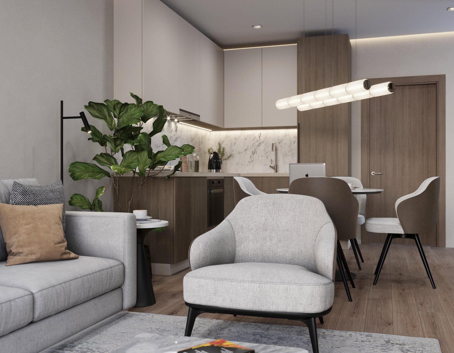 Modern open-plan living room and kitchen with beige sofa, armchair, dining table, and white cabinets with marble backsplash.