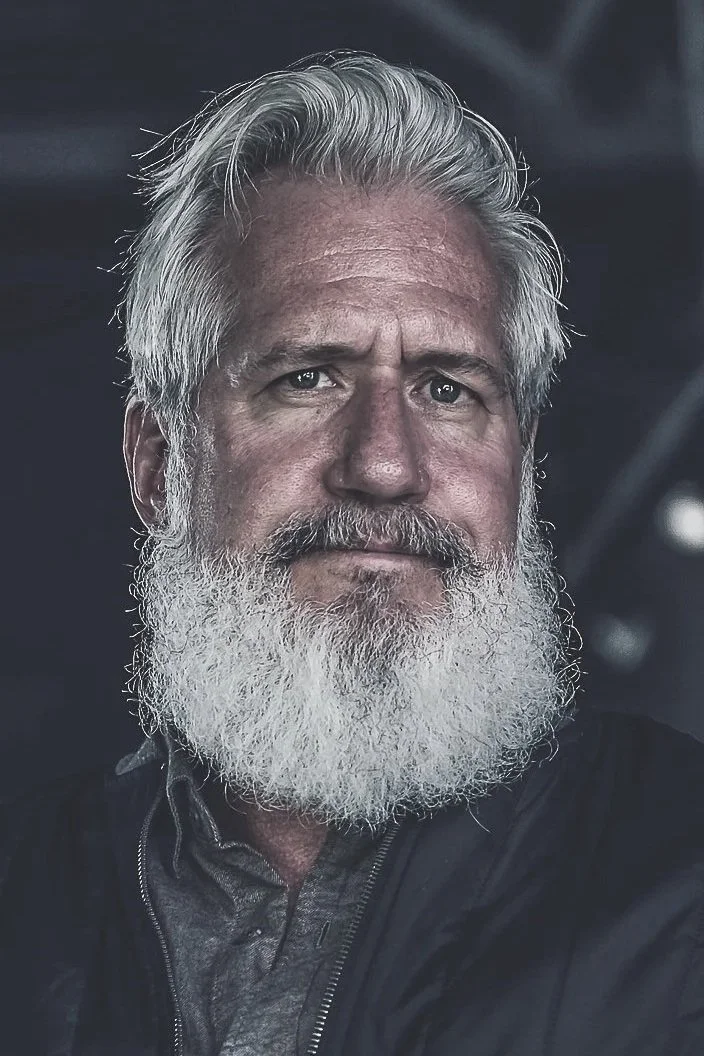 A portrait of Dr. Charles Igel—teacher, professor, and narrator.