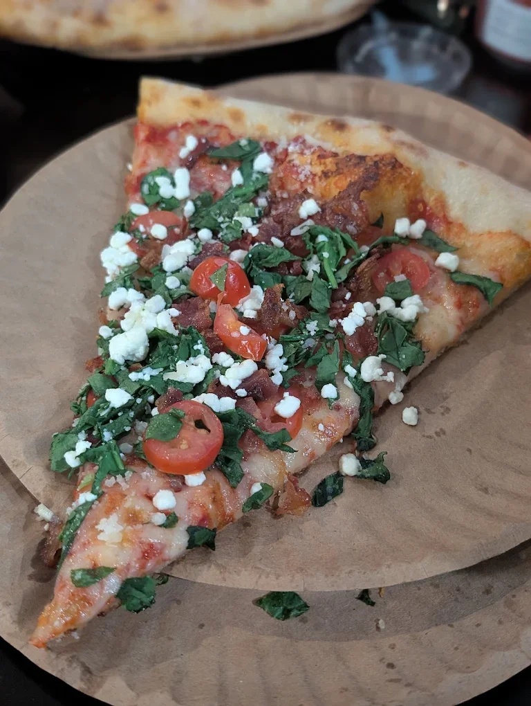 Razzo Pizzeria Goat slice.webp