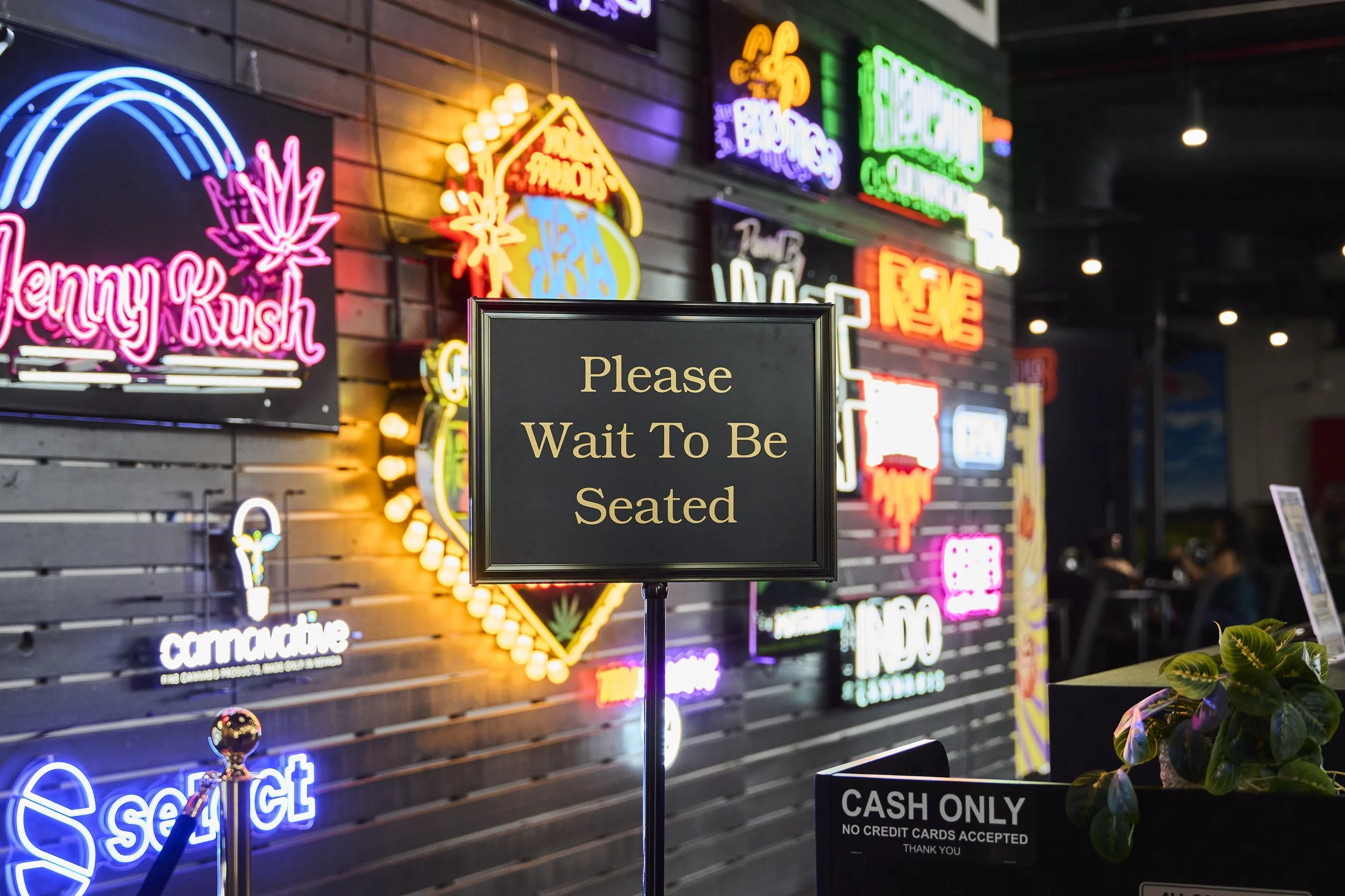 Neon-lit interior of Sky High Lounge cannabis lounge inside NuWu Main Dispensary in downtown Las Vegas