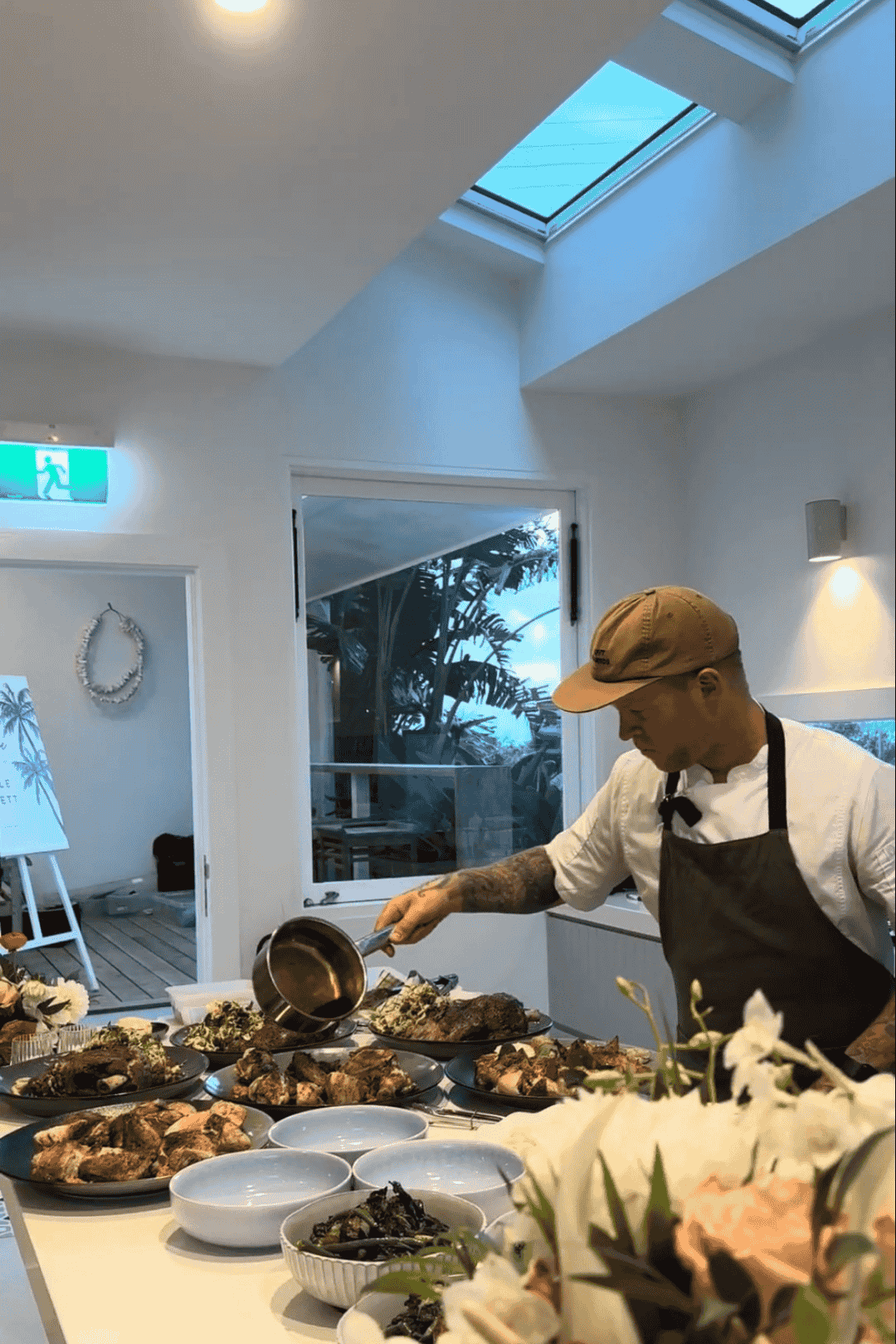 Ash Marcantelli preparing a banquet at a home in Newcastle.png