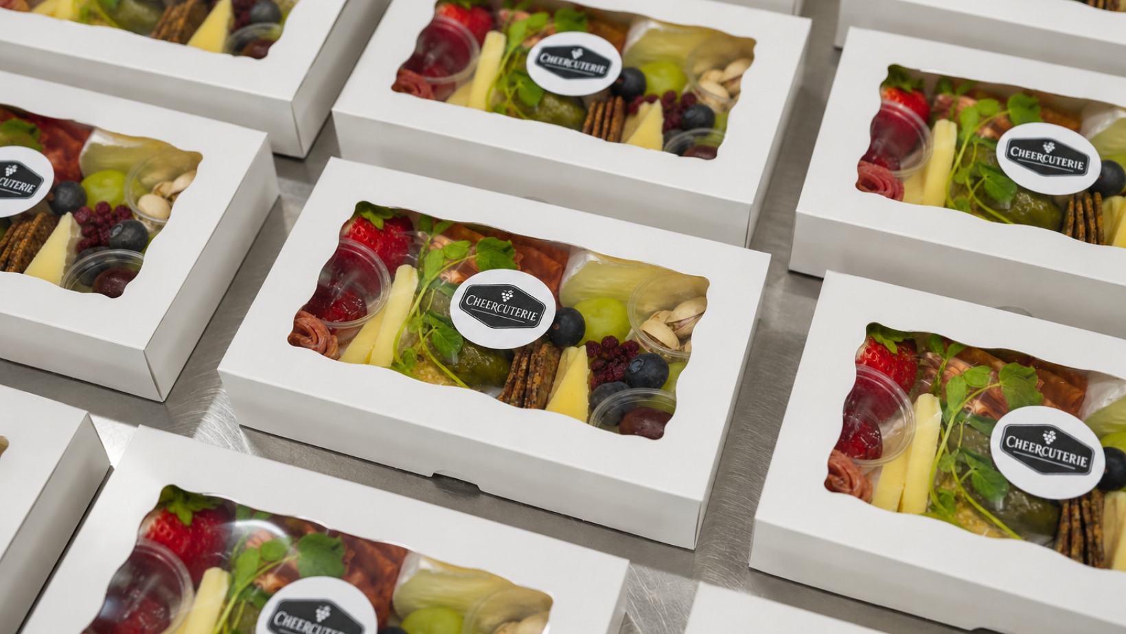 Gourmet charcuterie boxes with artisan cheeses, meats and fresh produce by Cheercuterie Kelowna