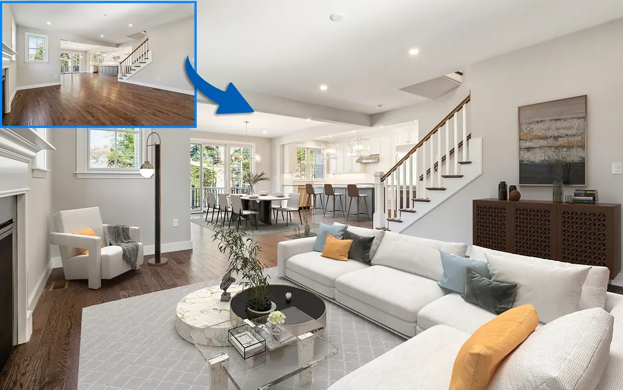 Open-concept living and dining room with white walls, hardwood floors, a white sectional sofa, and a kitchen in the background with a breakfast bar and modern decor.