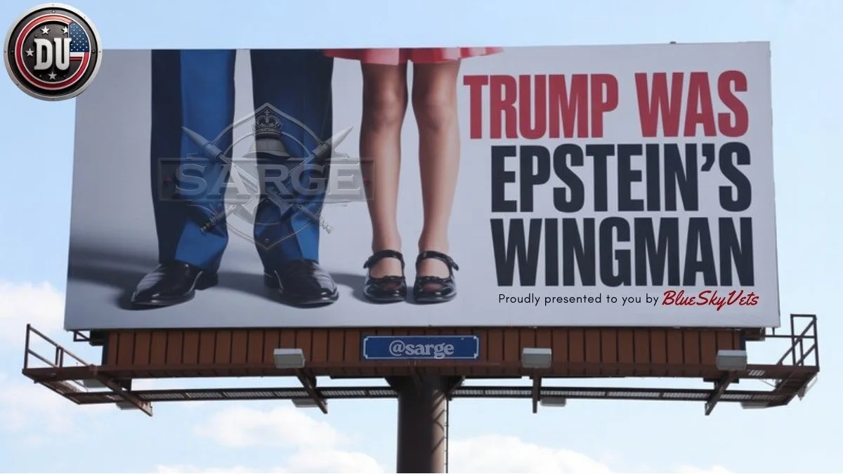 Billboard showing the lower halves of a man's and a girl's legs, with the man dressed in a suit with a flag design and the girl in a pink dress with black shoes. The text on the billboard reads, "TRUMP WAS EPSTEIN'S WINGMAN," with a smaller line of text saying, "Proudly presented to you by BlueSkyVets." The logo in the top left corner is from Duke University.
