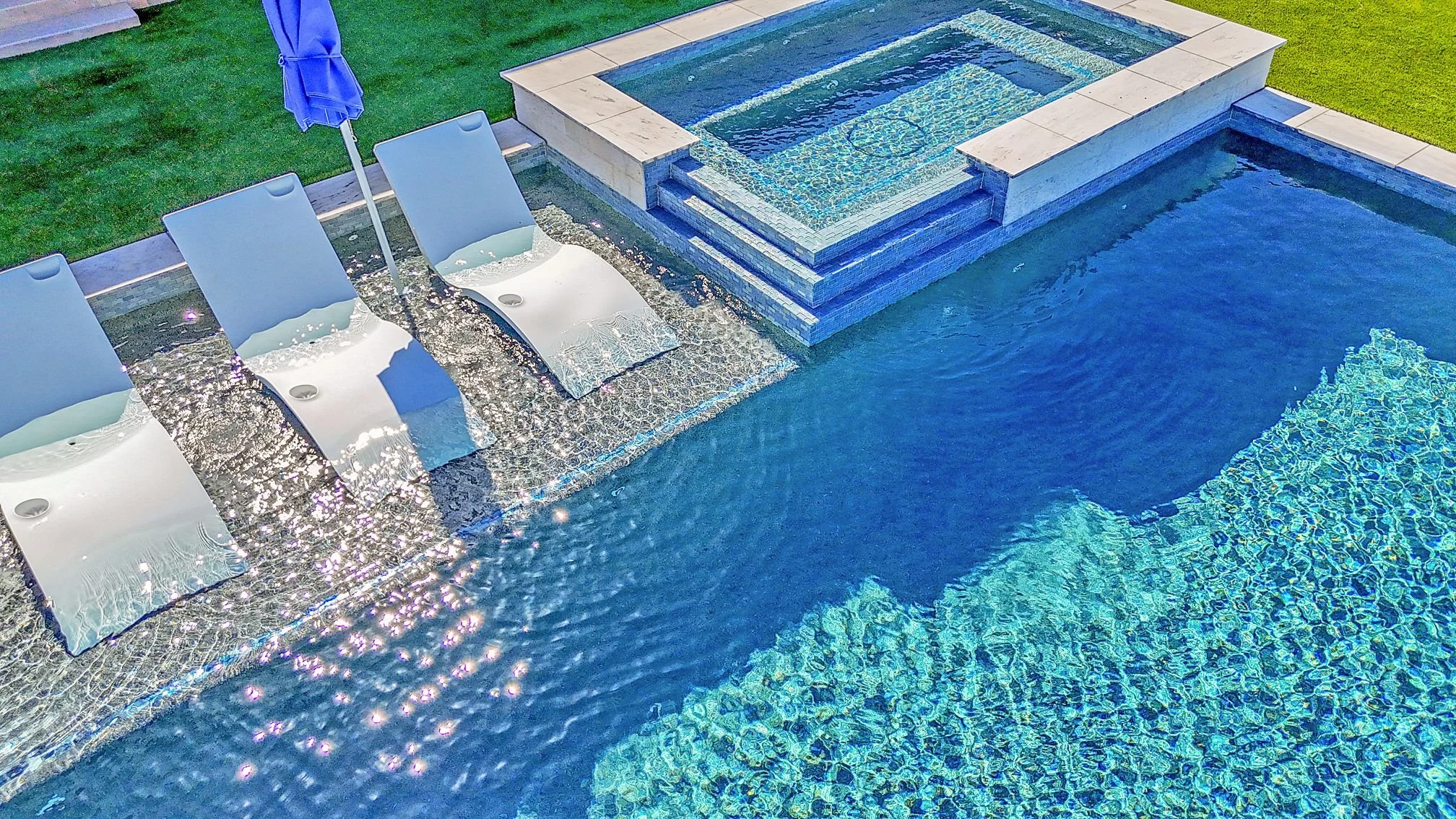 modern pools & spas layout surrounded by patio in San Angelo, TX