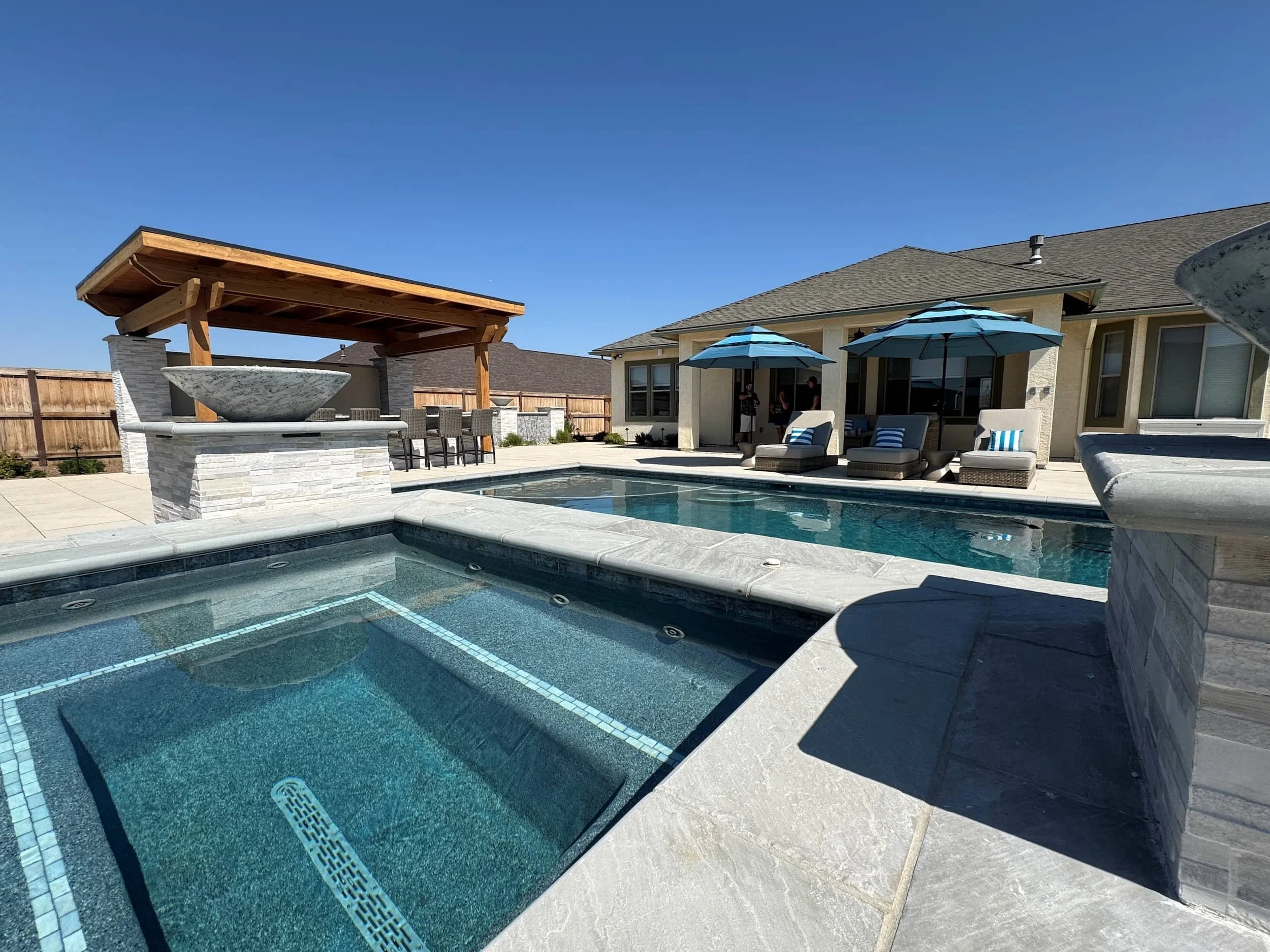 Landscape design stone patio and garden feature in Andrews, TX