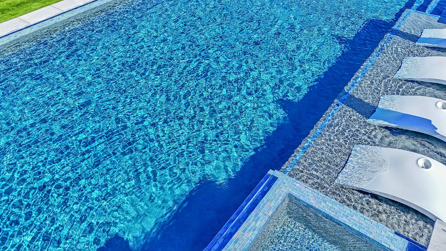 Inground pool design integrated with landscape design in Andrews, TX