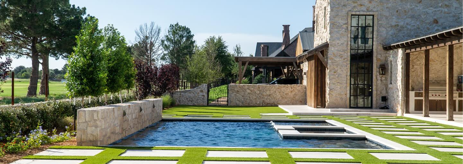 Landscape design with retaining walls and artificial turf in Fort Stockton, TX