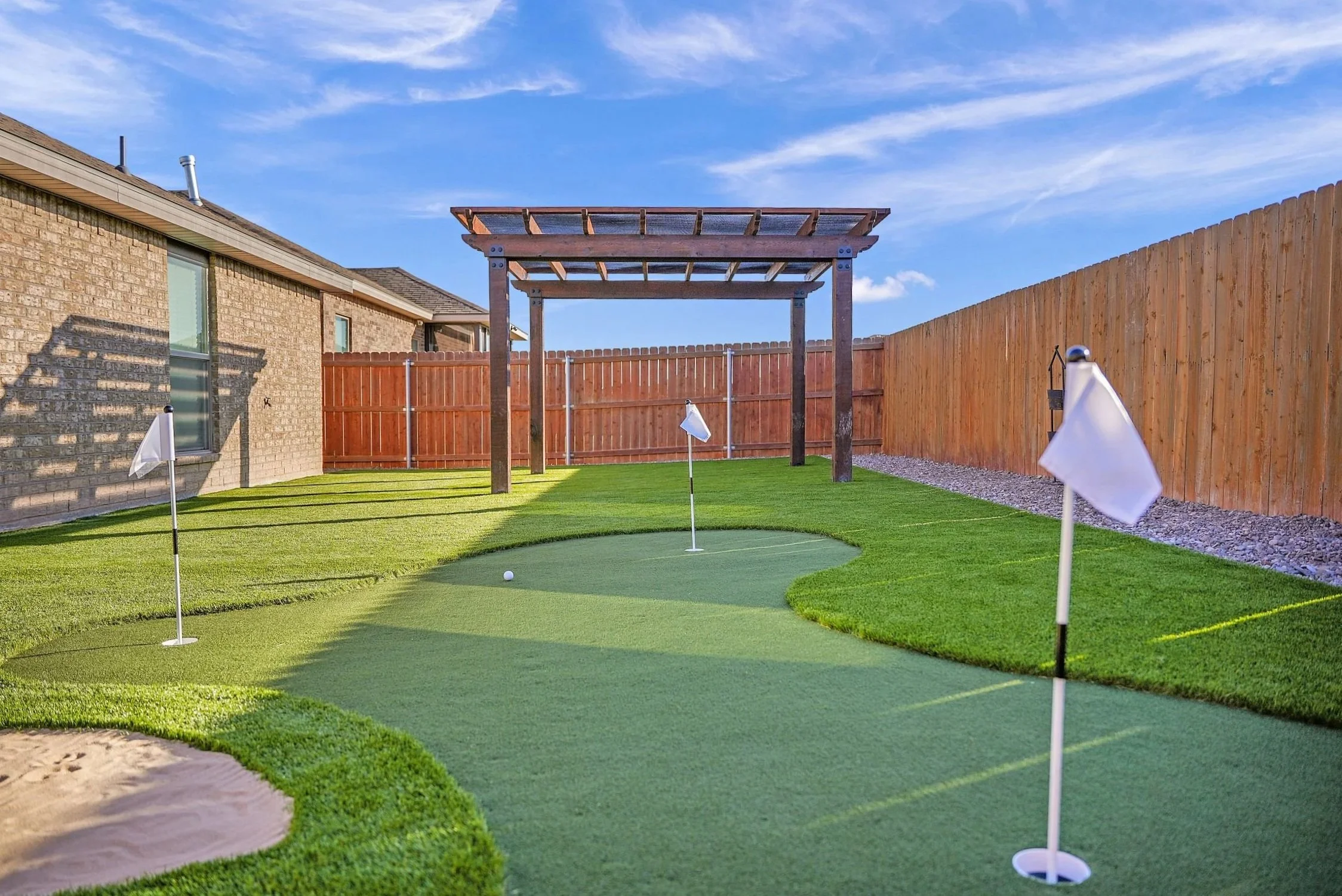 Putting green and pergola backyard upgrade in Lubbock, TX