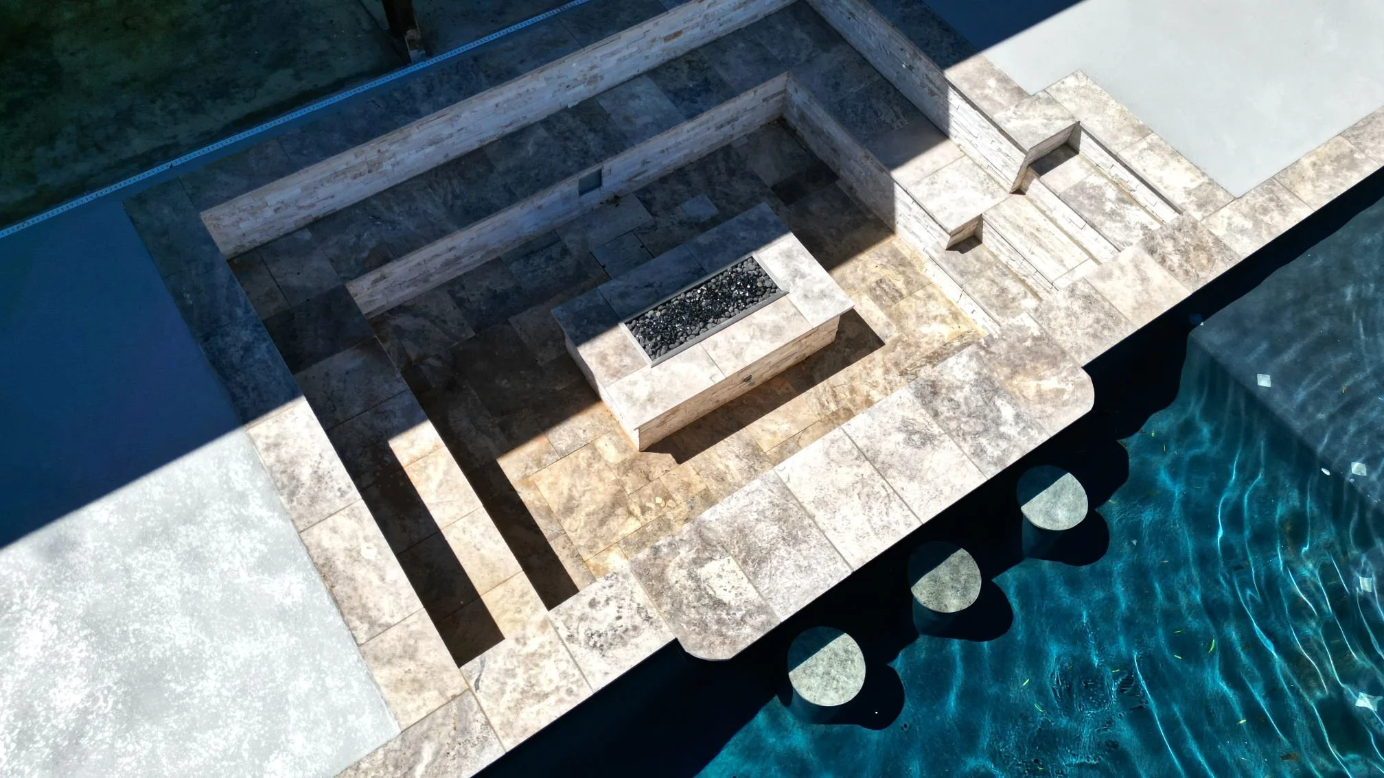 Retaining wall and patio builder near me project on uneven terrain in Monahans, TX