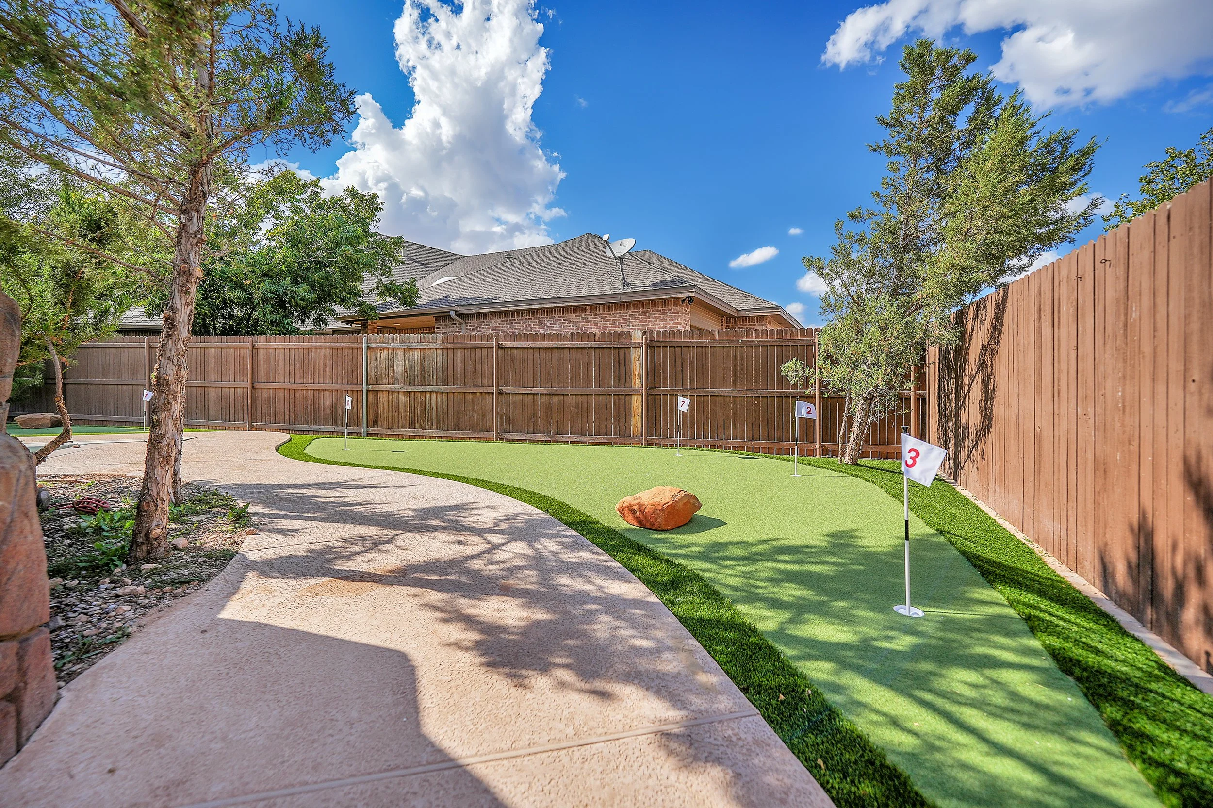 backyard putting green with contoured surface in San Angelo, TX