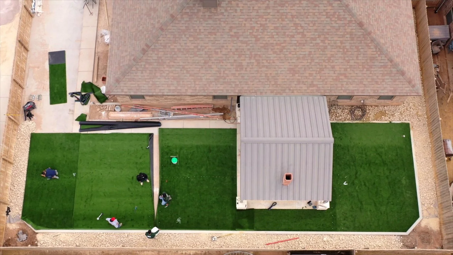 Team members installing artificial turf in Seminole, TX