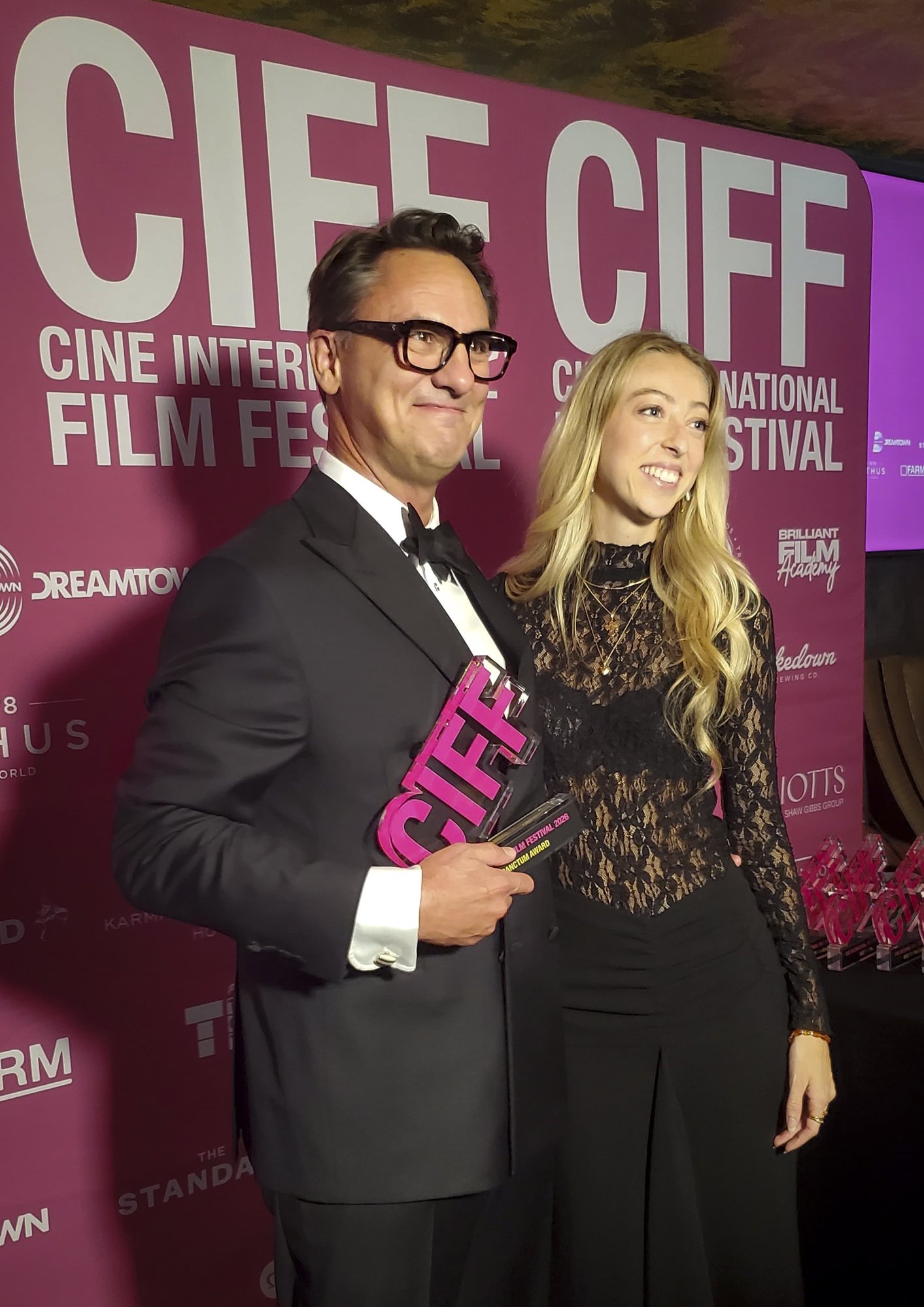 Jim Koenigsaecker accepting an award for Voyage of the Handala from Camille Koefoed at the Cine International Film Festival in London