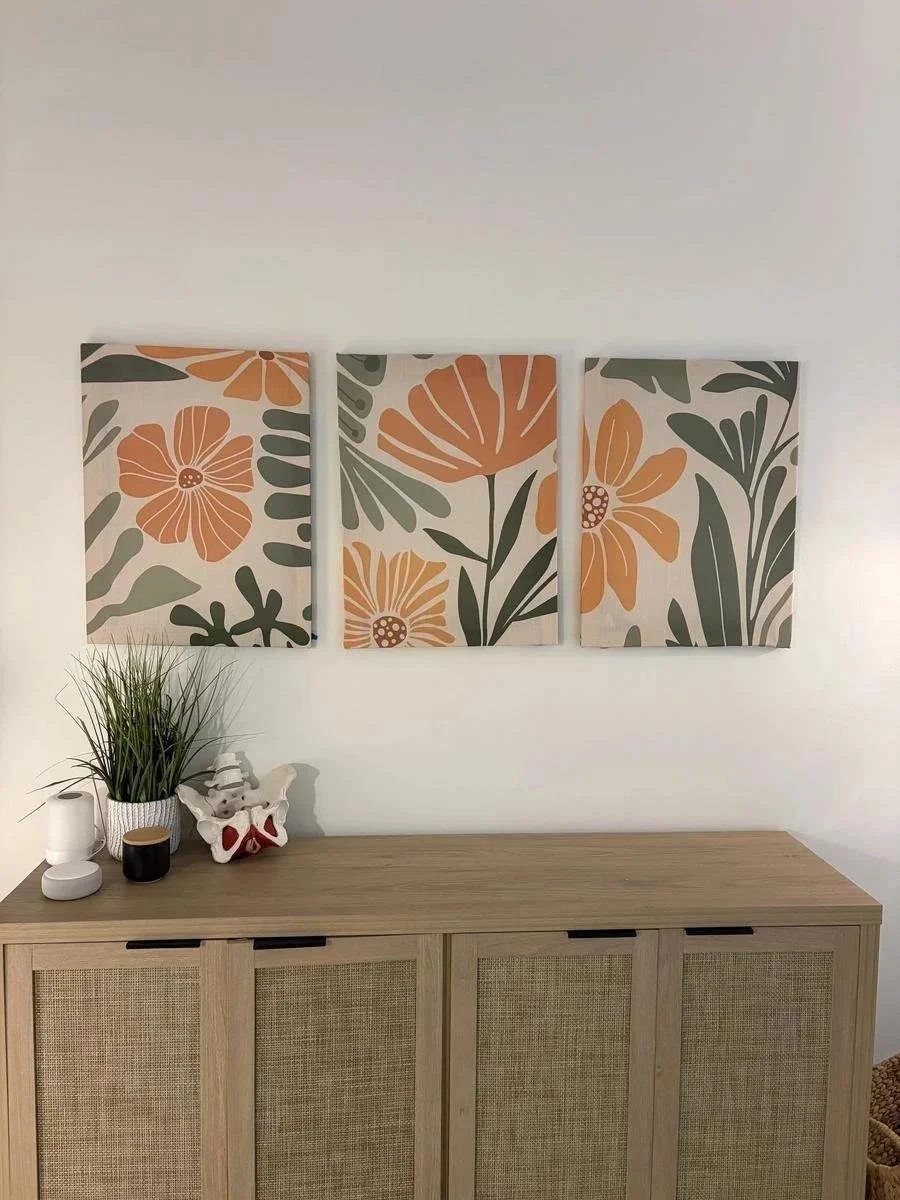 Floral wall art above a wooden console in the Avonlea Brown Physical Therapy office, Costa Mesa, CA — Avonlea Brown Physical Therapy, Costa Mesa, CA.