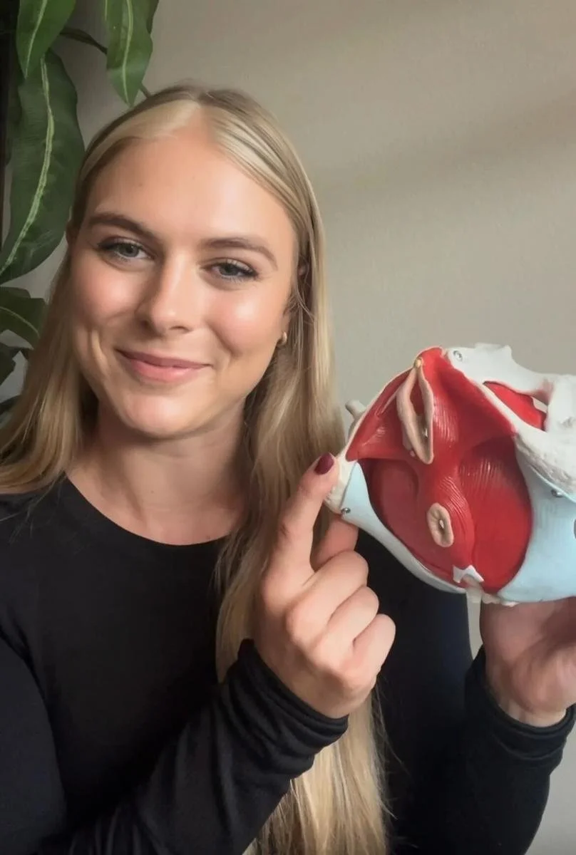 Dr. Avonlea Brown, PT, DPT holding an anatomical pelvic floor model in Costa Mesa, CA — Avonlea Brown Physical Therapy, Costa Mesa, CA.