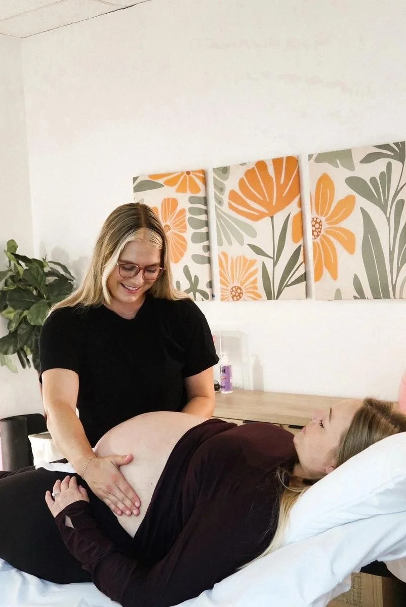 Dr. Avonlea Brown palpating a pregnant client's belly during a prenatal session — Avonlea Brown Physical Therapy, Costa Mesa, CA.