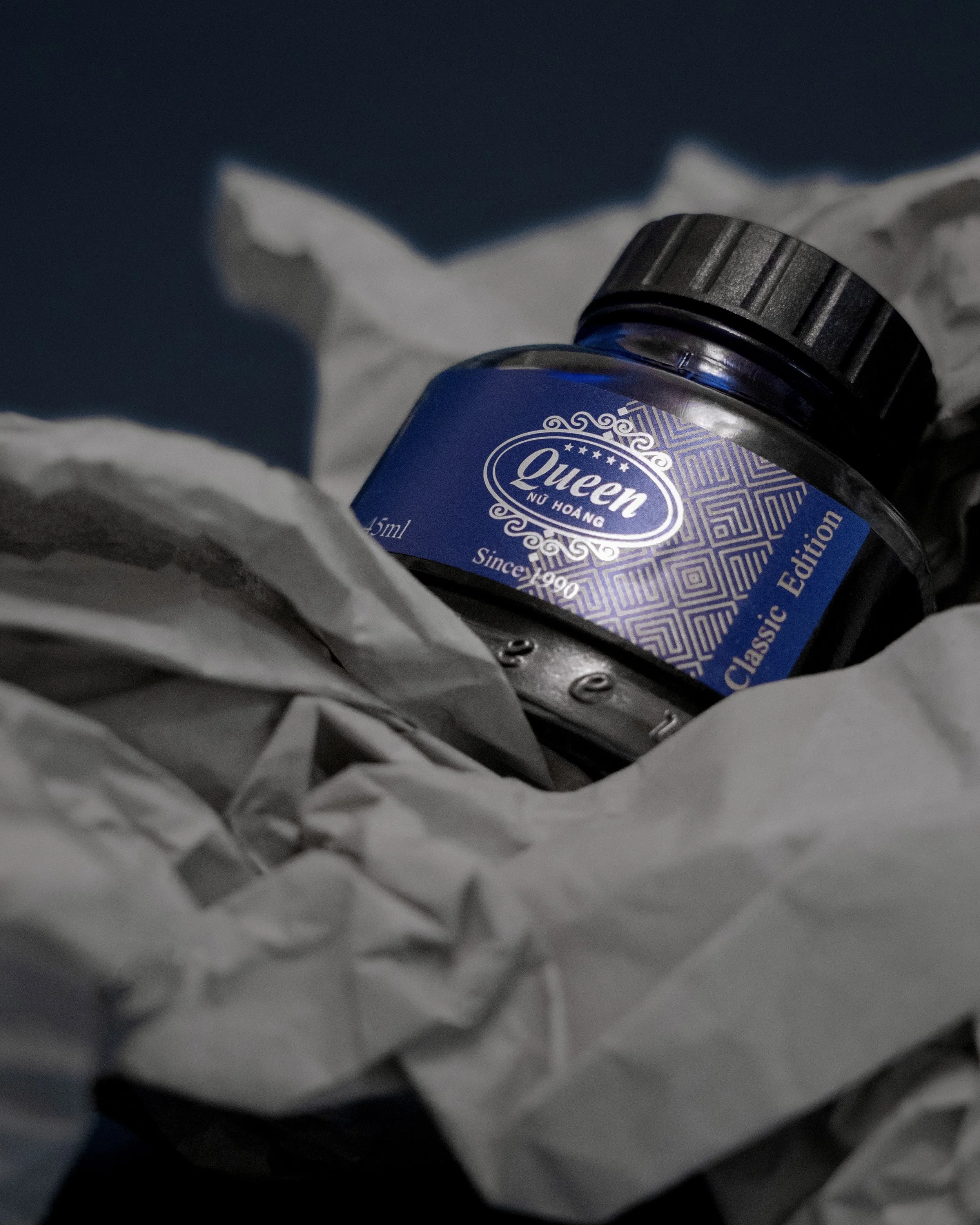 Blue fountain pen ink and grey paper