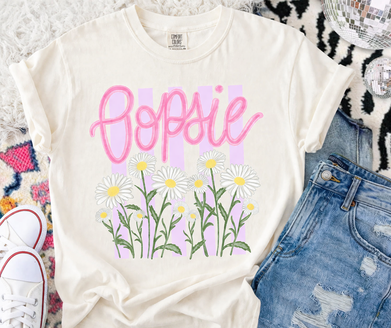 Pastel tee with daisies and accessories.png