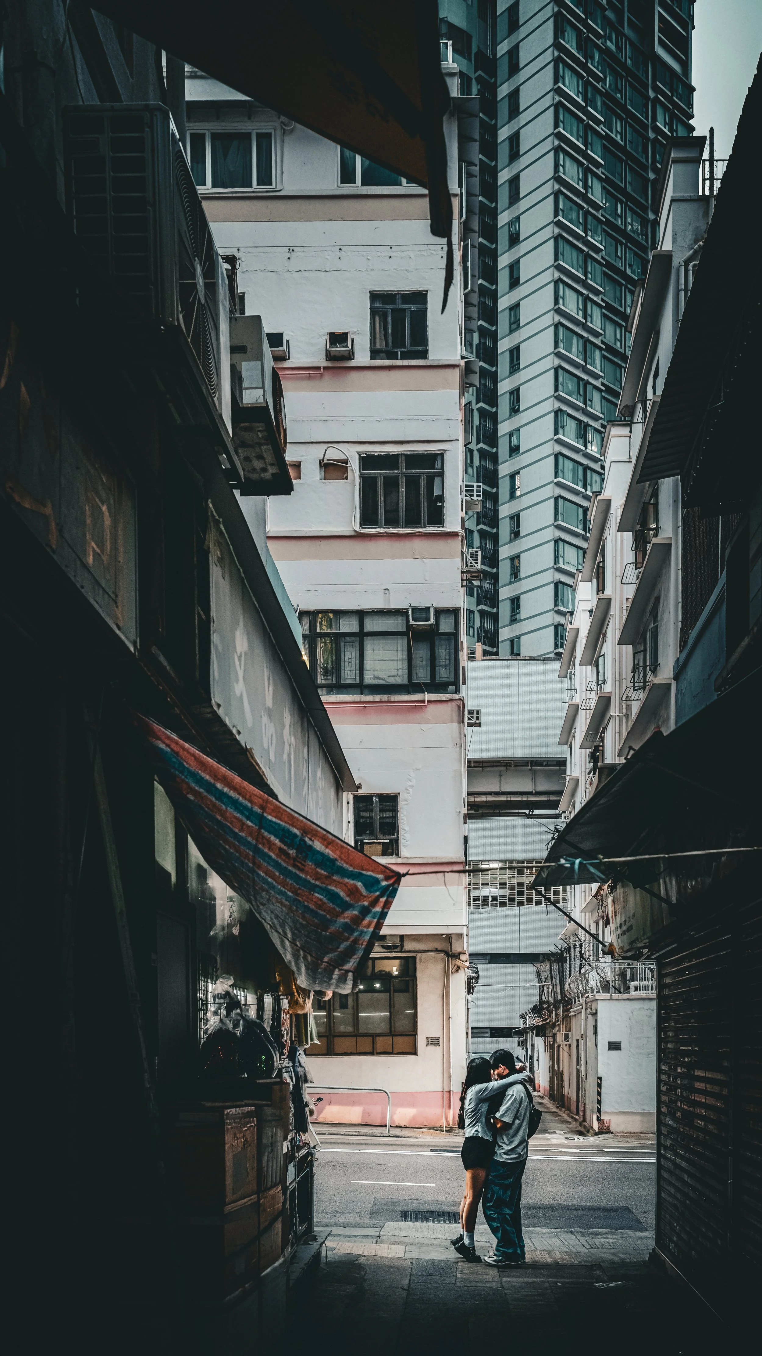 Love Alley: In Hong Kong, where space comes at a premium, lovers find a moment of intimacy in one of city back alleys.