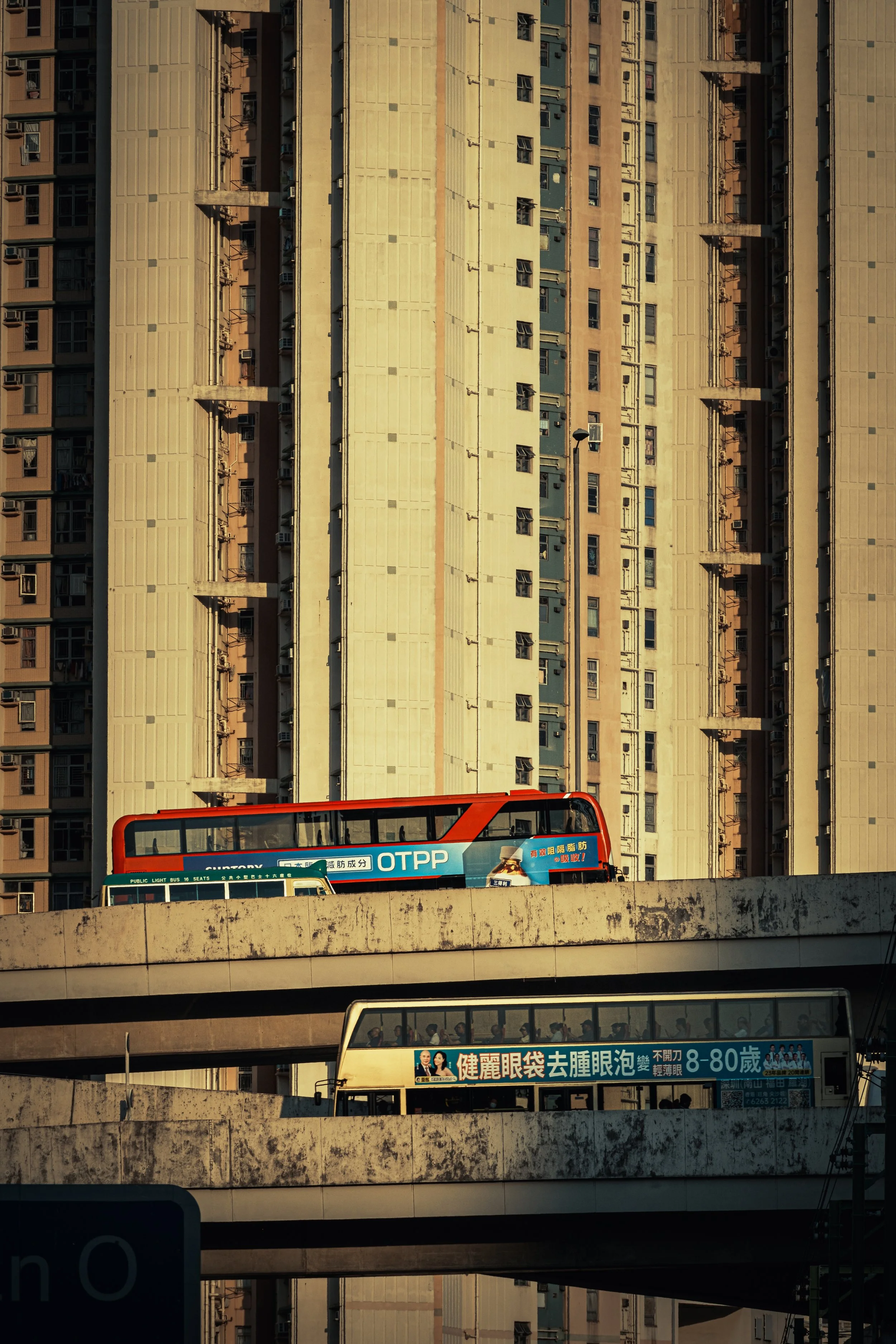 Urban Layers: A double crossing road bridge against a packed backdrop of Public Housing