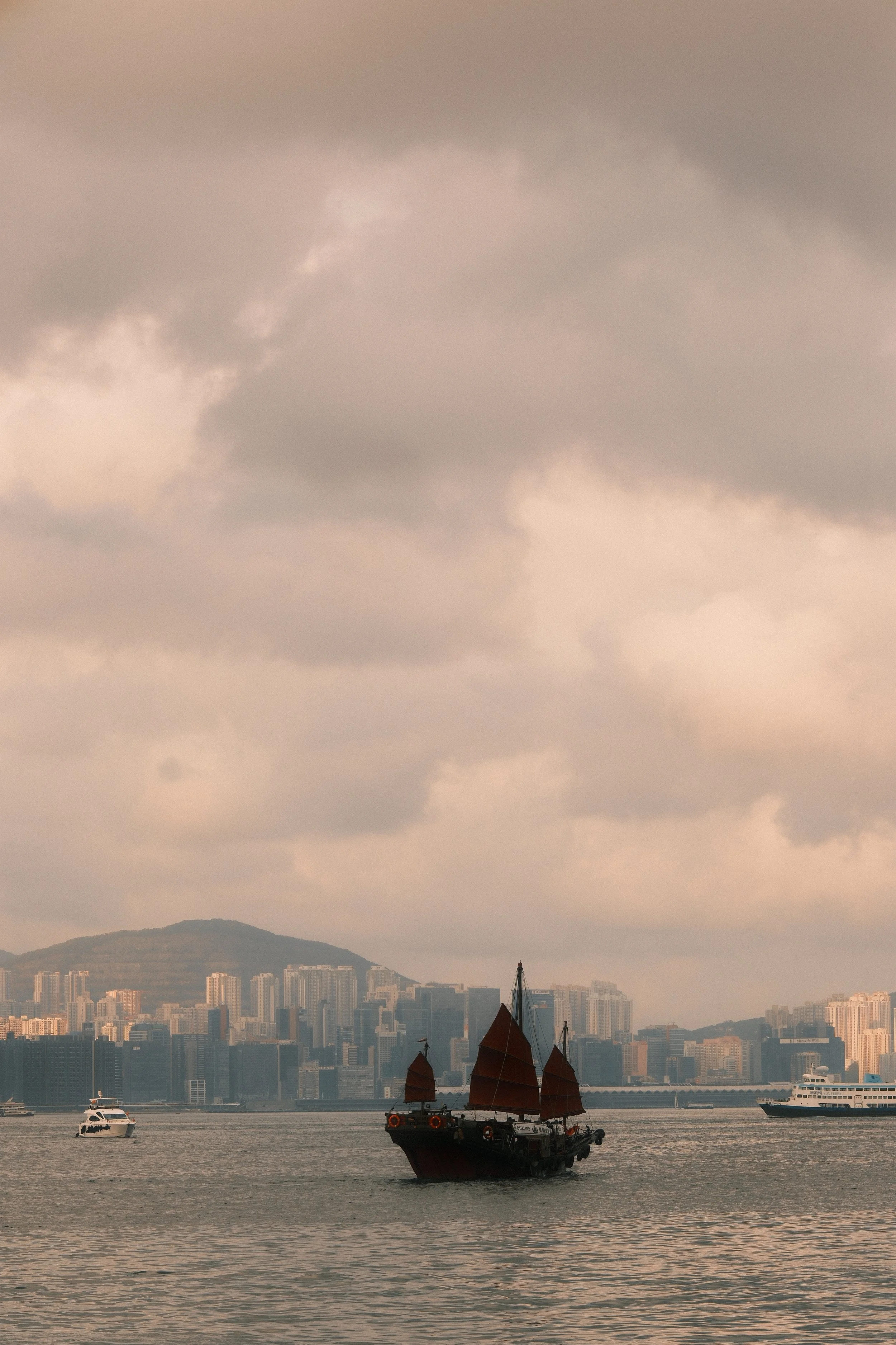 Aqua Luna: The only remaining traditional Chinese junk boat crossing Victoria Harbour late afternoon