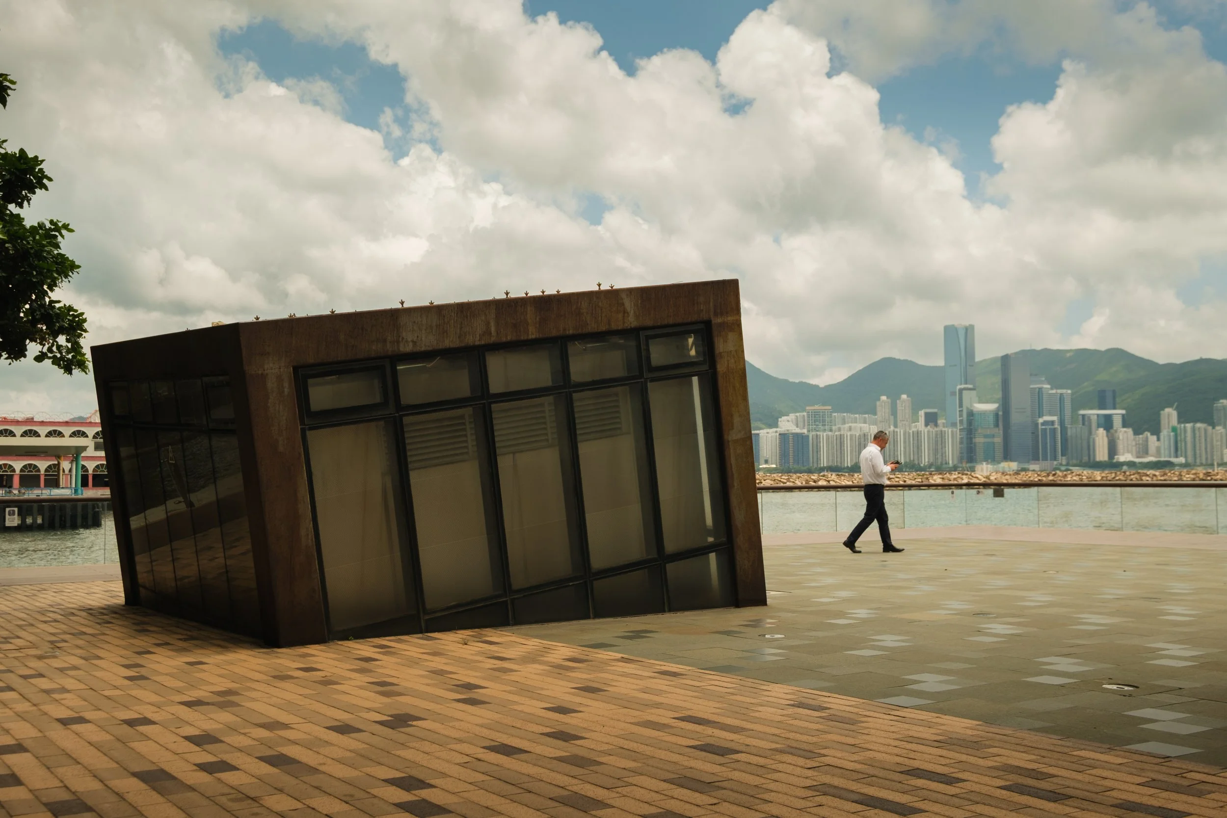 The Man in the Box: A man emerges from a container art installation on Kwun Tong Promenade, merging art with the city’s energy