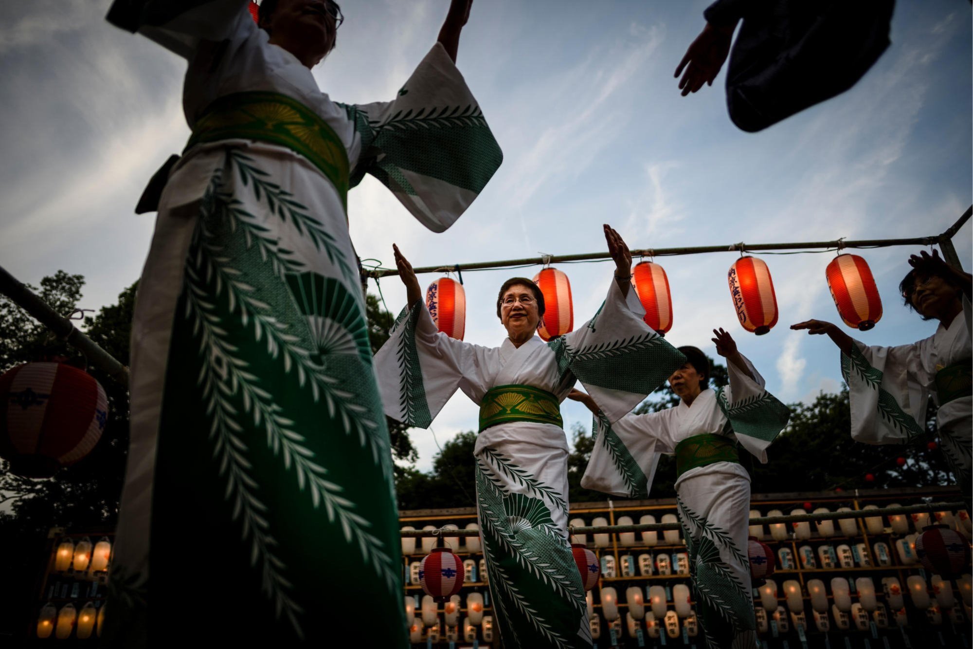 women-in-traditional-clothes-dancing-under-lanterns.jpg