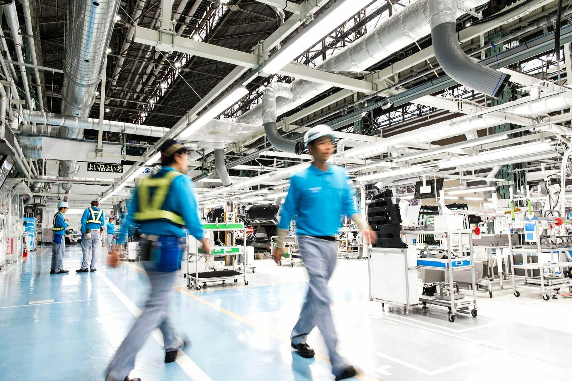 workers-walking-on-toyota-assembly-line.jpg