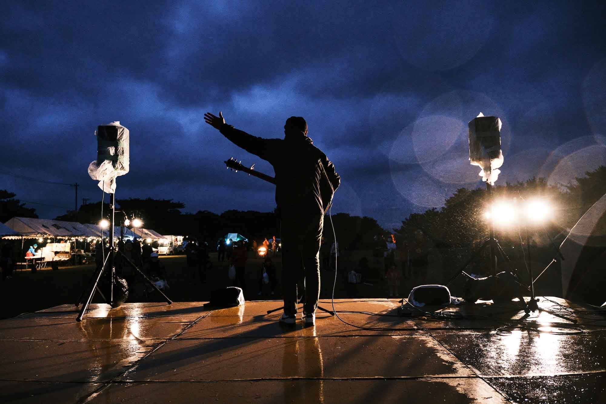 A local musician performs at an outdoor arts and music festival in the Yanbaru region of Okinawa, Japan.