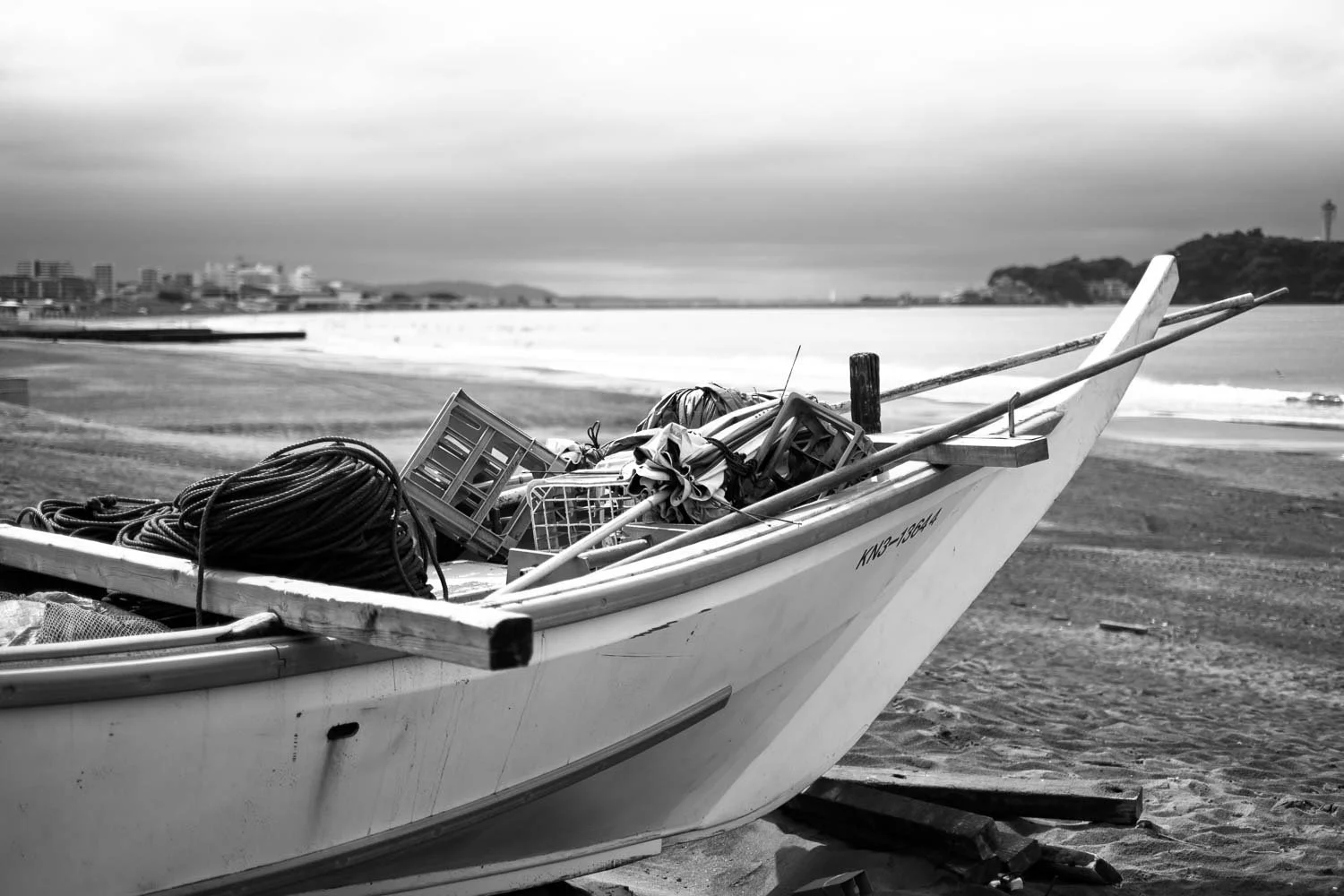  Fishing boat loaded with ropes and gear on the beach at Enoshima, photographed in black and white with the Fujifilm X-H2. 