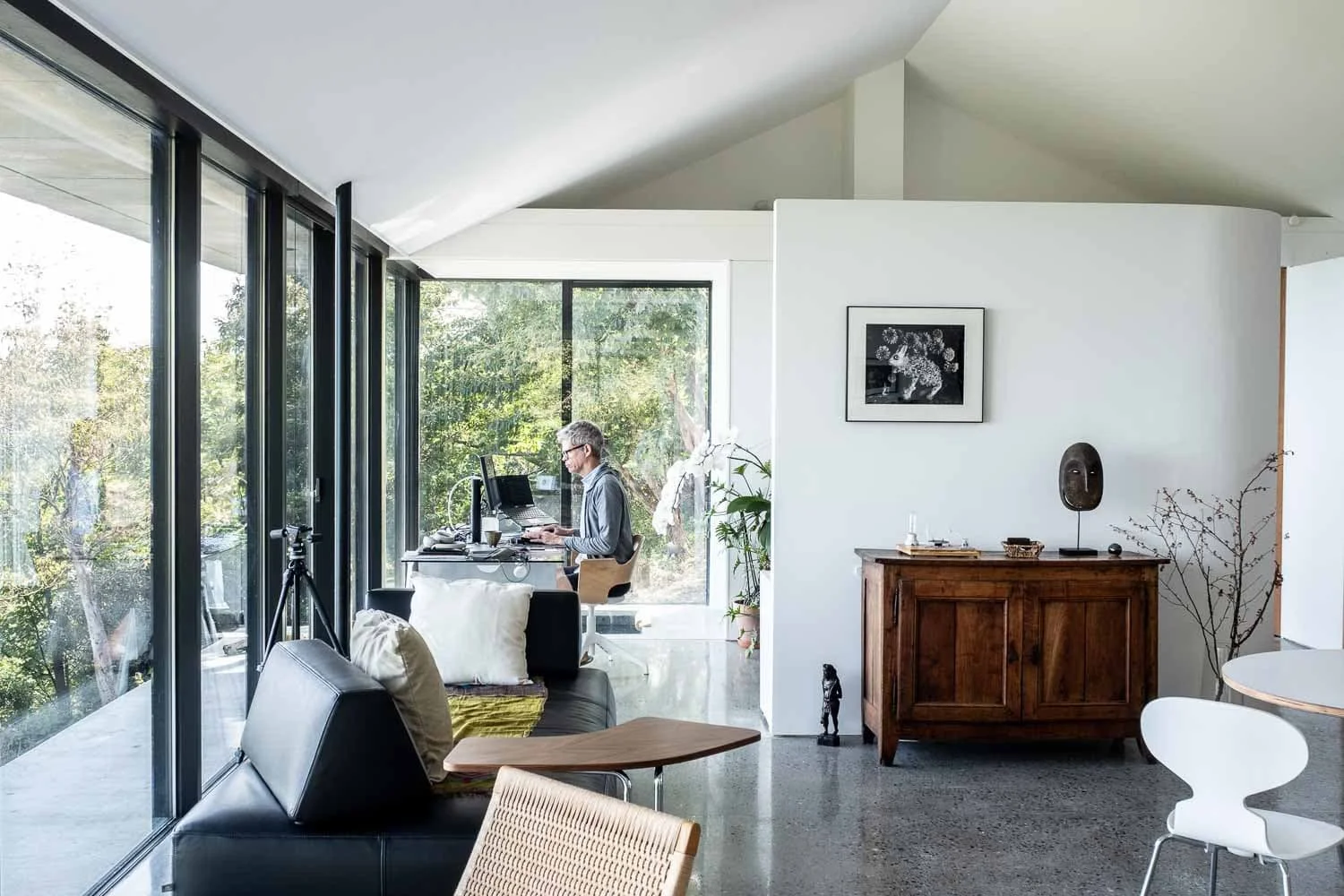  David Thevenin at his desk inside his home on Japan’s Izu Peninsula. The house reflects his passion for architecture, art, and minimalism. 