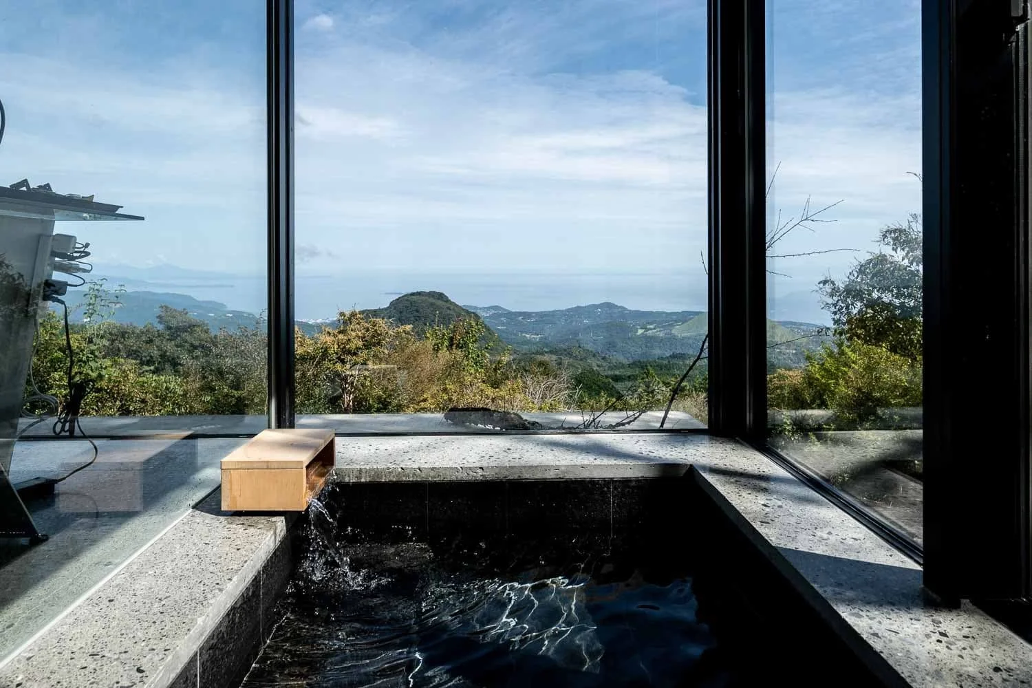  A spring-fed onsen bathtub inside David Thevenin’s Izu Peninsula home, photographed by Ben Weller, an editorial and commercial photographer based in Japan. 
