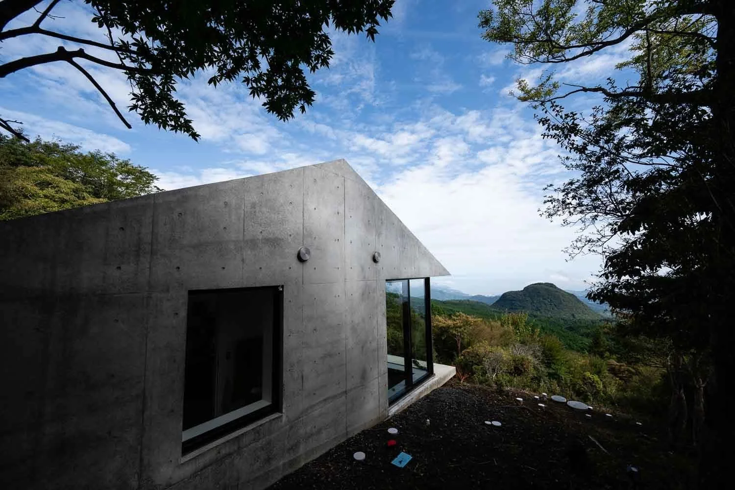  Morning light on David Thevenin’s 980-square-foot concrete home on Japan’s Izu Peninsula. Designed by Tokyo-based Florian Busch Architects, the house overlooks a chain of dormant volcanoes and Sagami Bay. 