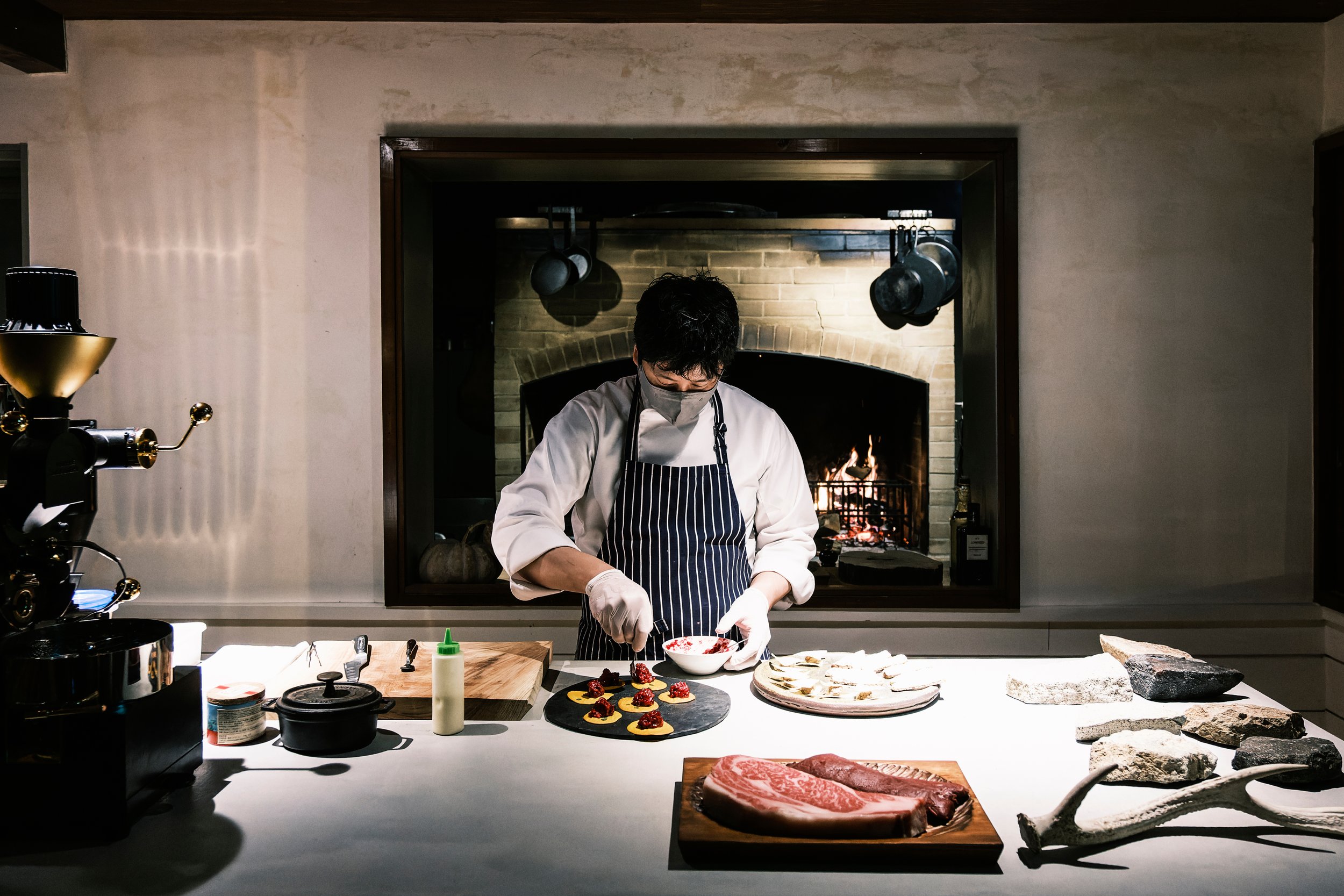  Chef Teppei Oyama serves local ingredients and signature Akaushi beef, grass-fed on the slopes of Mt. Aso, in the open kitchen at Yamagoya HolaHoo in Aso, Kumamoto Prefecture. 