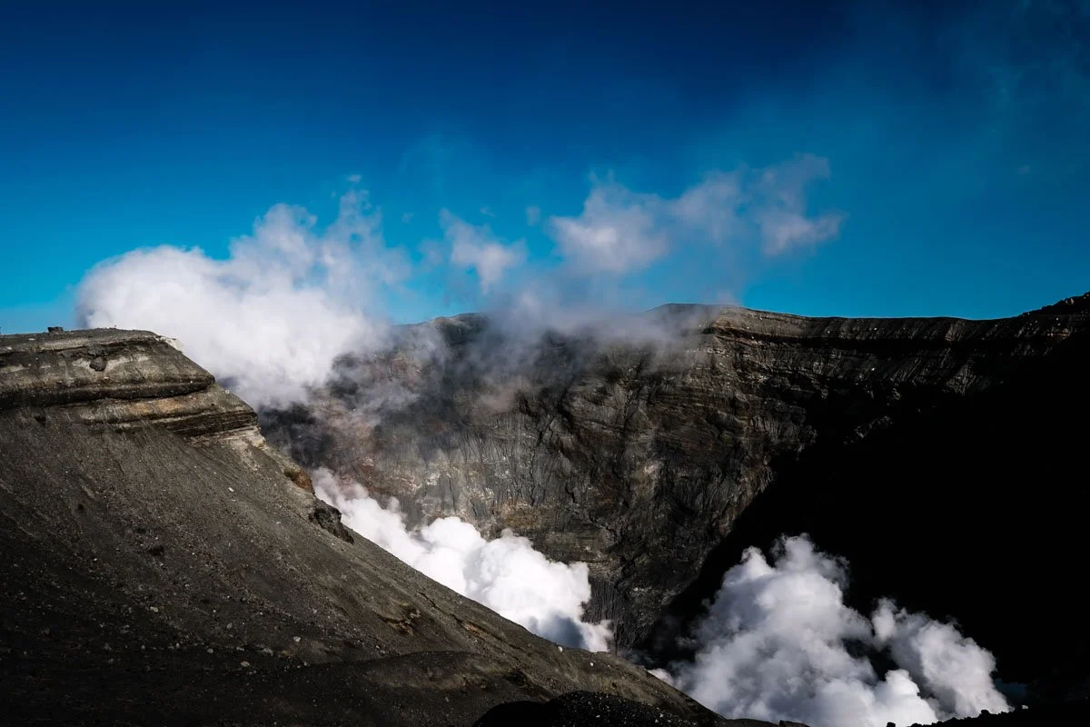  The smoking caldera of Nakadake Crater at Mt. Aso in Kumamoto Prefecture, part of the volcanic landscape that shapes the region’s agriculture, cuisine, and sense of place. 