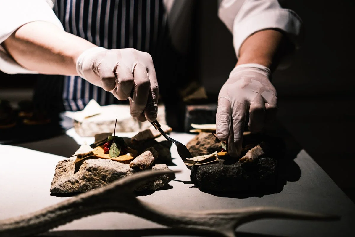  Chef Teppei Oyama serves local ingredients and signature Akaushi beef, grass-fed on the slopes of Mt. Aso, in the open kitchen at Yamagoya HolaHoo in Aso, Kumamoto Prefecture. 