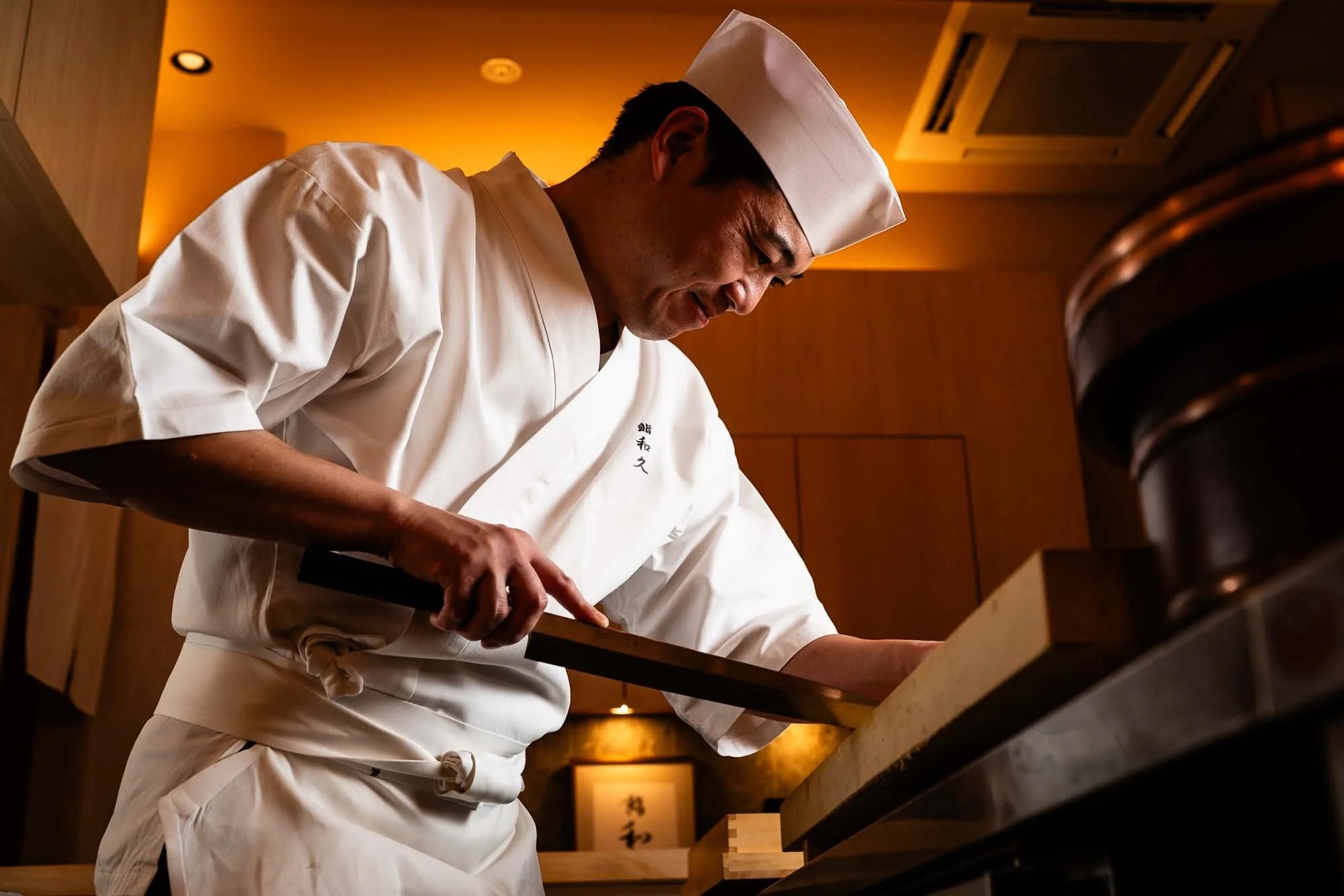 At Tokyo's Sushi Waku, chef Michikazu Yoshida bends old techniques toward new flavors. Photographed by Tokyo-based photographer Ben Weller for Virtuoso, The Magazine.