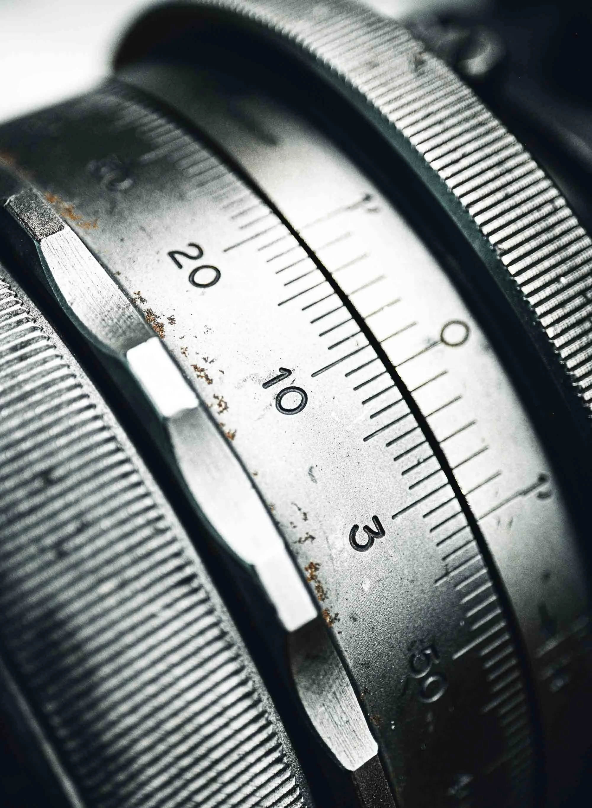 Close-up of an industrial measurement device with numbers and markings on it.
