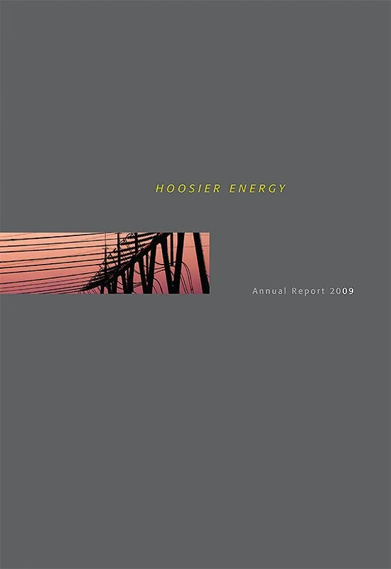 Cover page of Hoosier Energy Annual Report 2009, featuring a silhouette of power lines at sunset under a gray background.