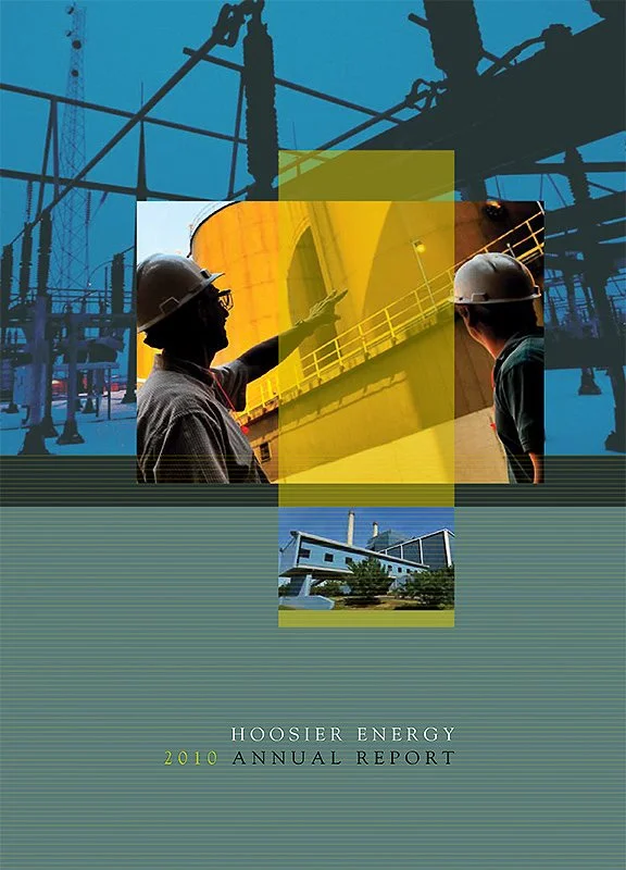 Cover of Hoosier Energy 2010 Annual Report showing two workers in hard hats inspecting equipment at an energy facility, with a background of electrical infrastructure and a small building with solar panels.