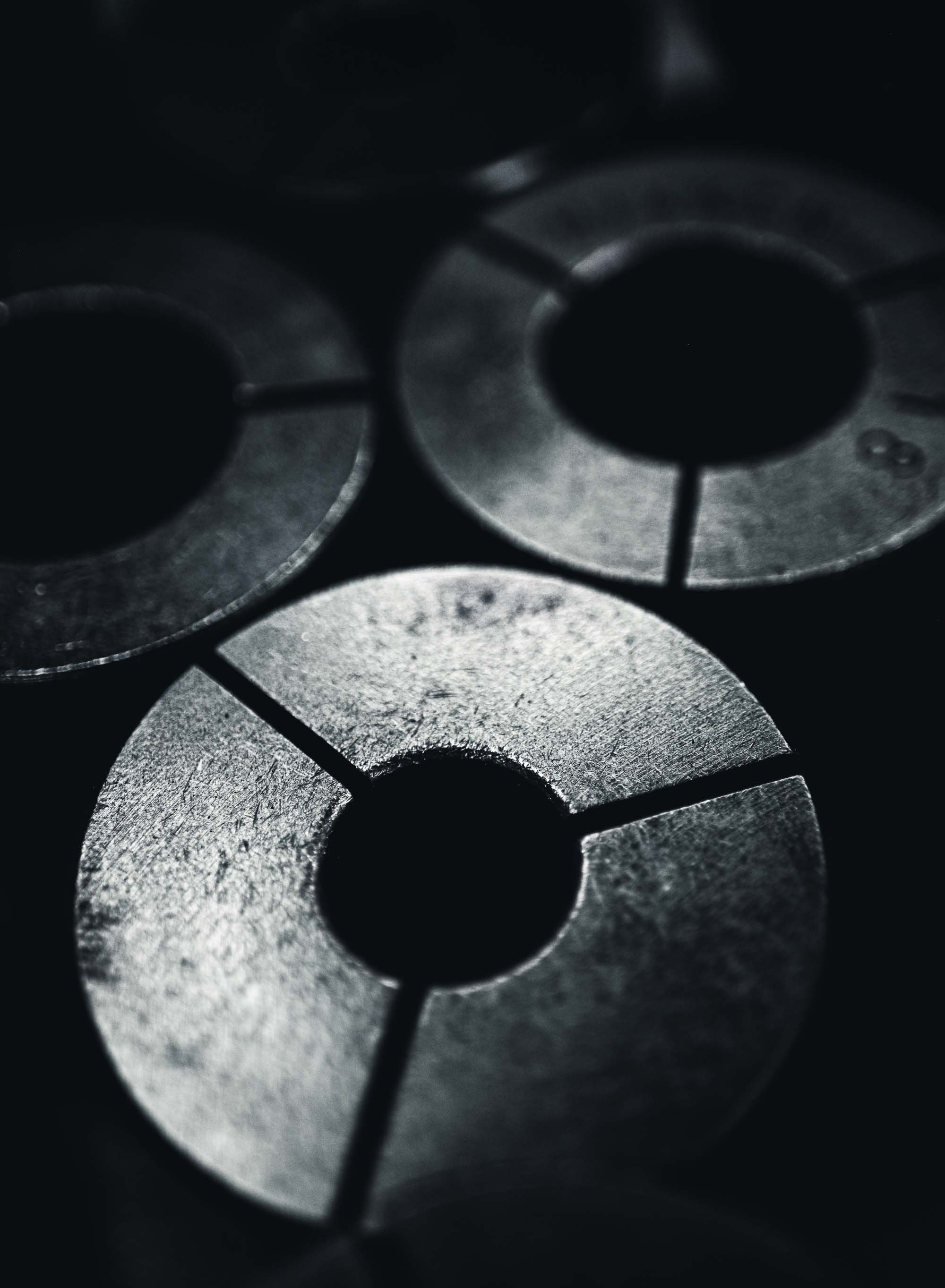 Close-up of circular metallic machine parts.