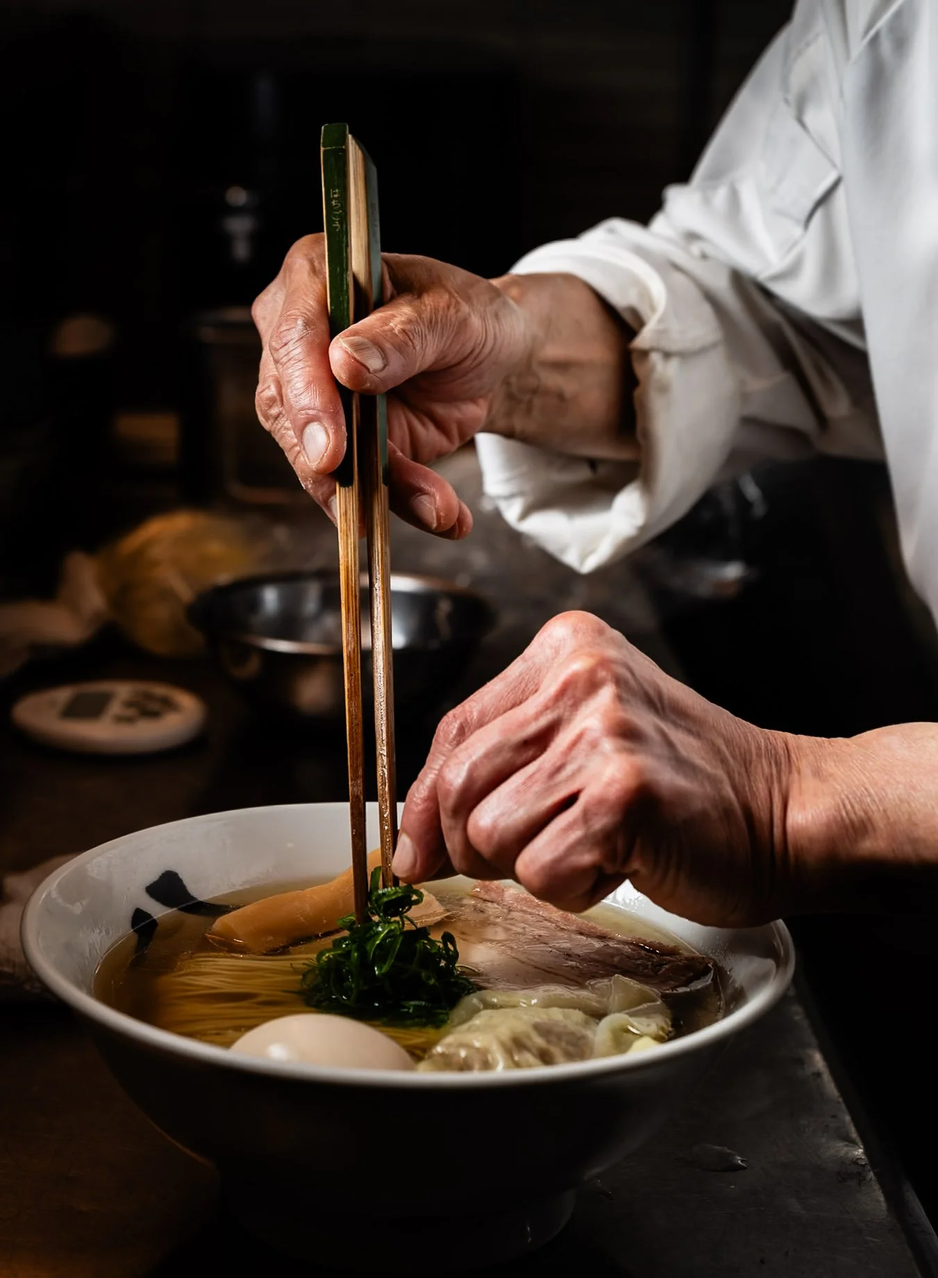 Yasushi Matsumura of Ginza Hachigou prepares the restaurants most popular dish, Gourmand Ravioli Ramen. The ramen is topped with delicate wontons filled with truffle and foie gras.