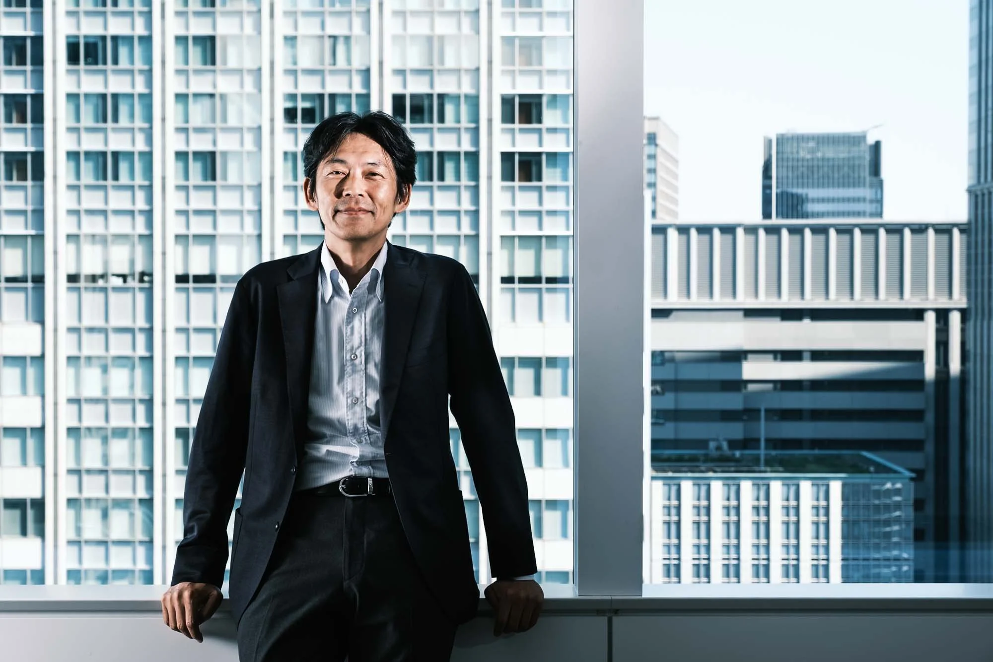 Environmental portrait of a Tokyo investor in his office.