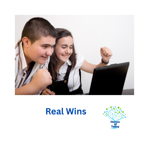 Two children celebrating while looking at a laptop screen