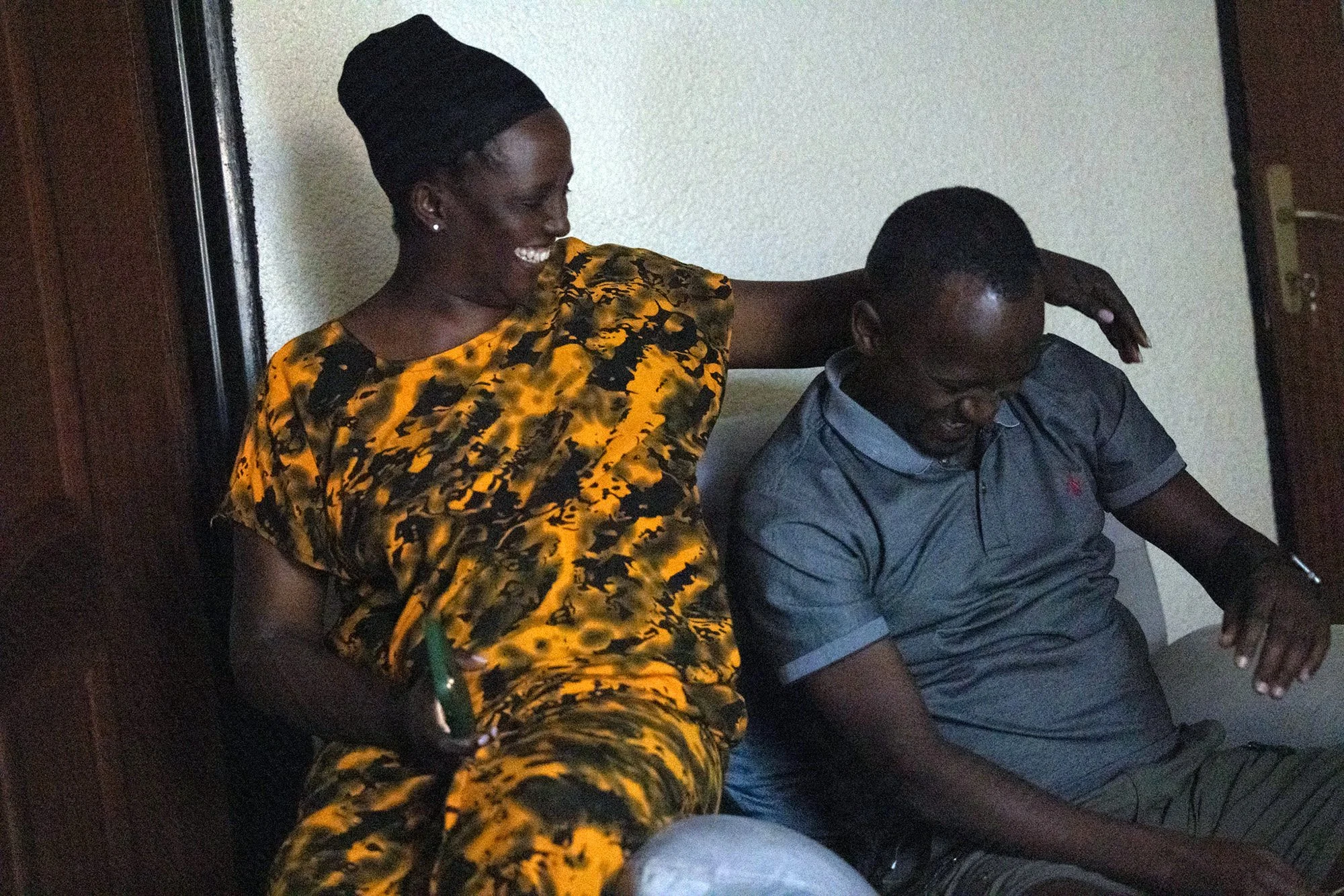 From left, Mary Nyangoma, Project Manager of the Nyamirambo Women’s center, and her boyfriend, Kayitana John Bosco, enjoy a nice evening together before bed on July 5, 2024, in Kigali, Rwanda. Nyangoma and her boyfriend are both long distance. 

