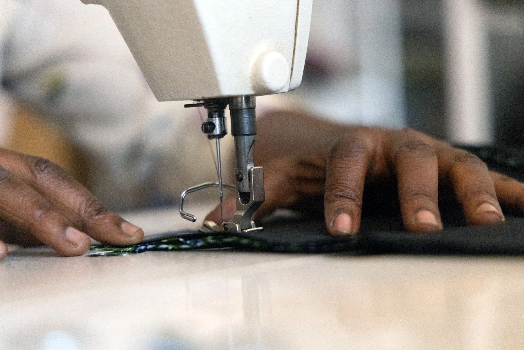 Worker from the Nyamirambo Women’s center sewing a piece of clothing for the store on July 6, 2024, in Kigali, Rwanda. 
